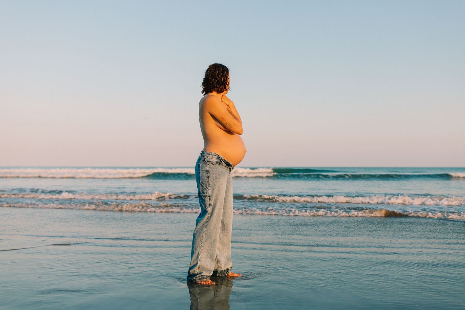 pregnant mother and ocean beach