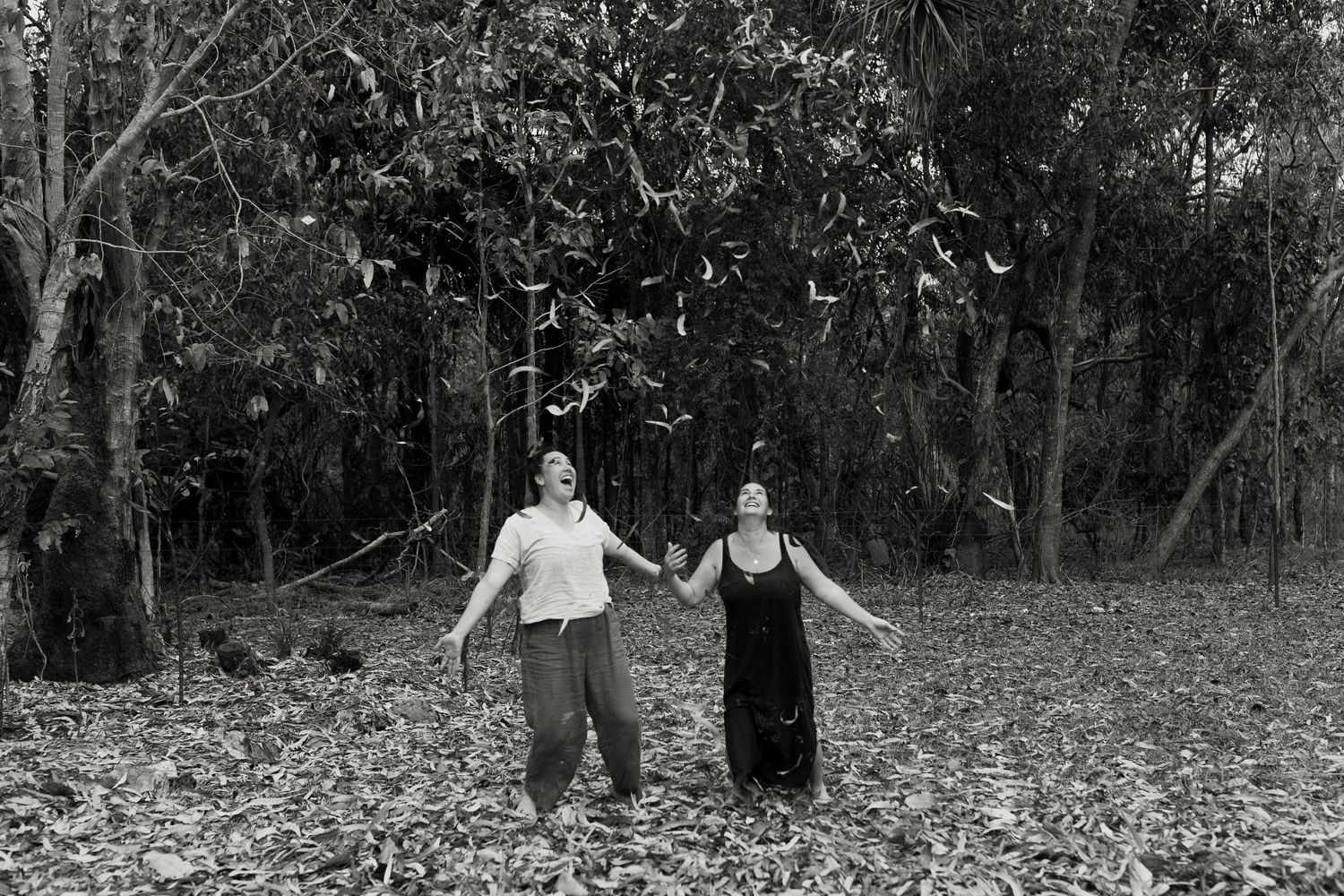 Rural family playing in the dry leaves