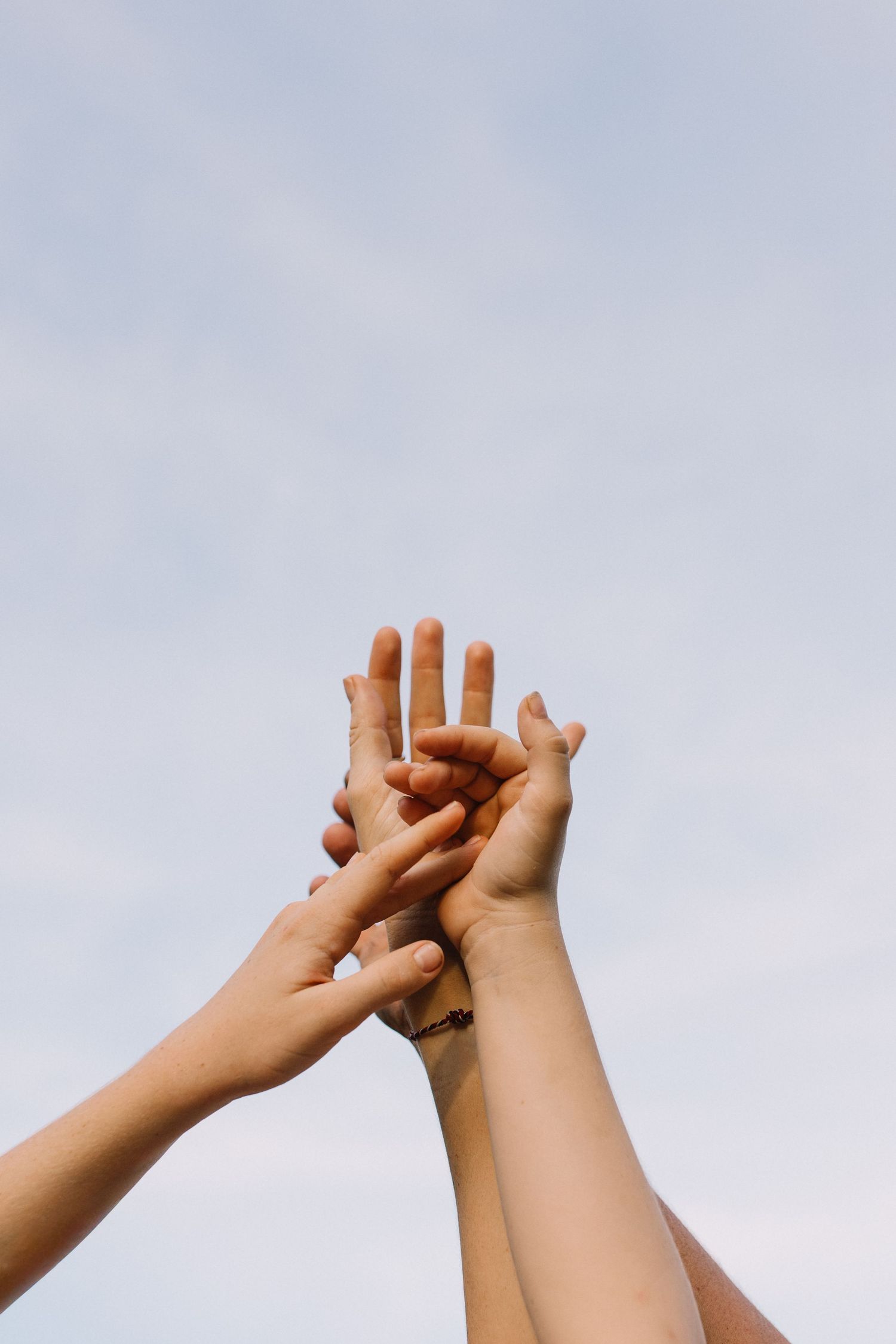 family hands and sky