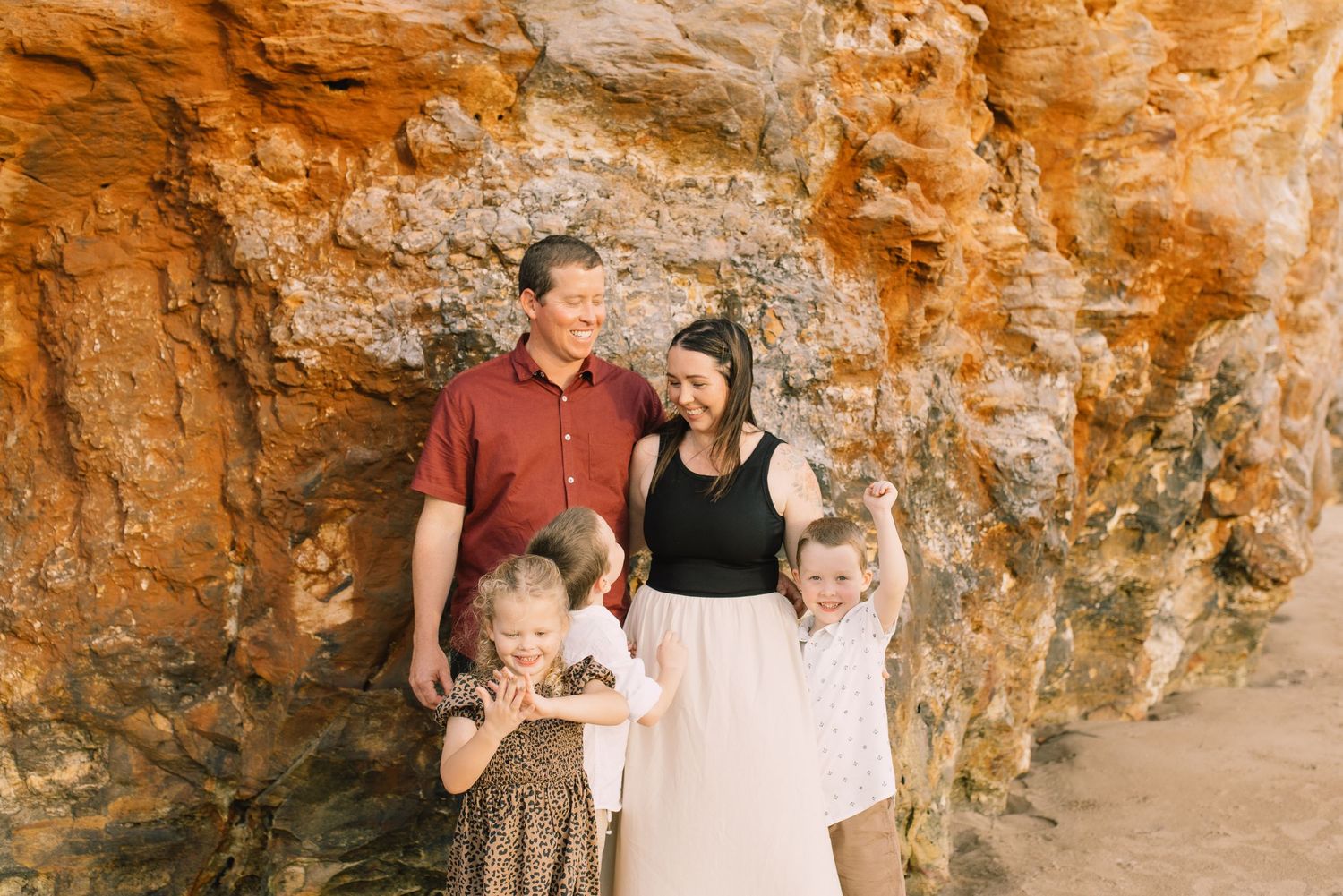 family with sandstone backdrop