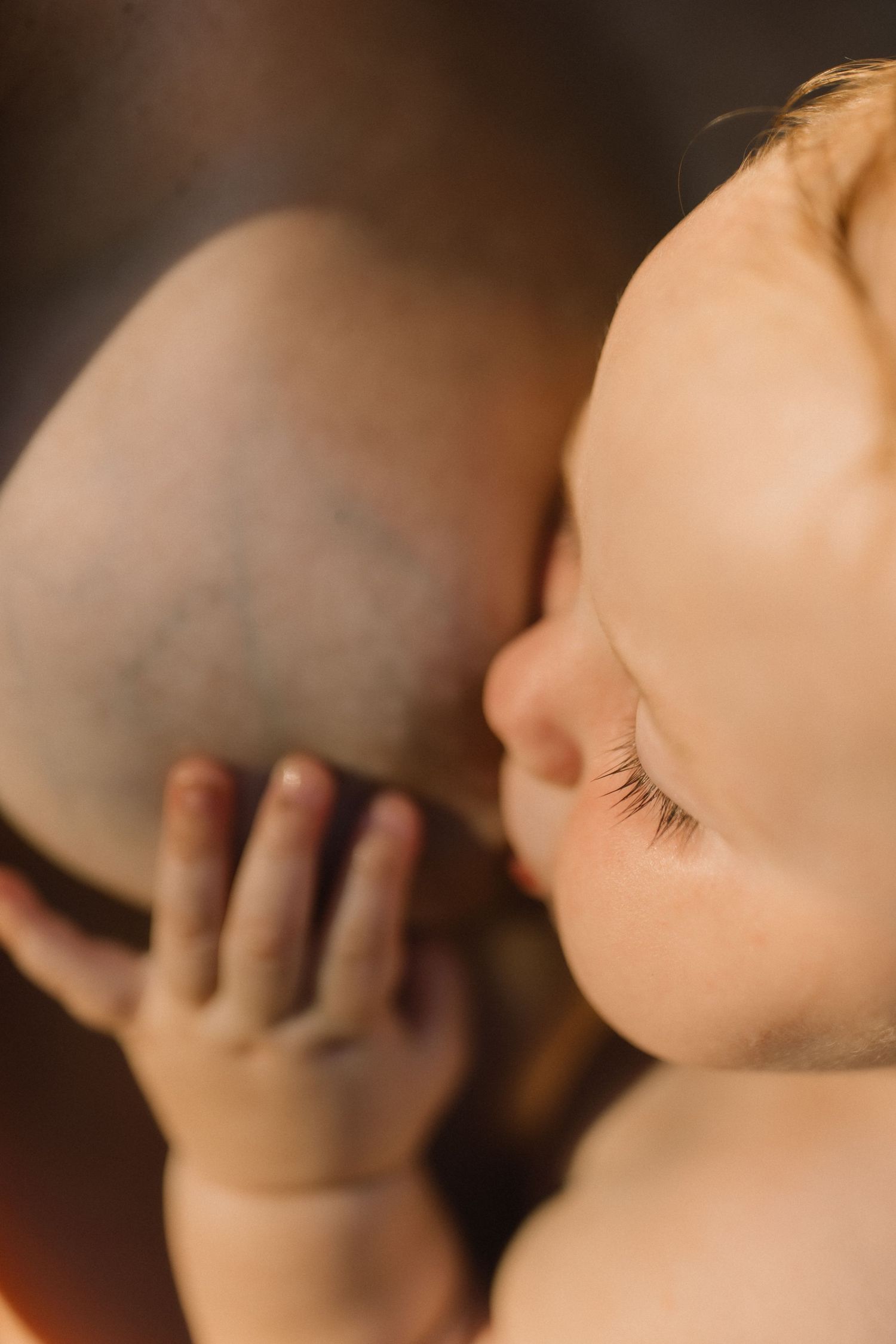 close up of breastfeeding feeding baby