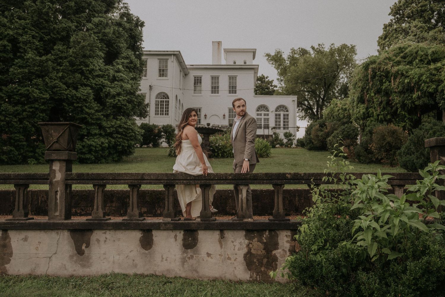 Wedding venue exterior featuring elegant architecture and lush greenery.