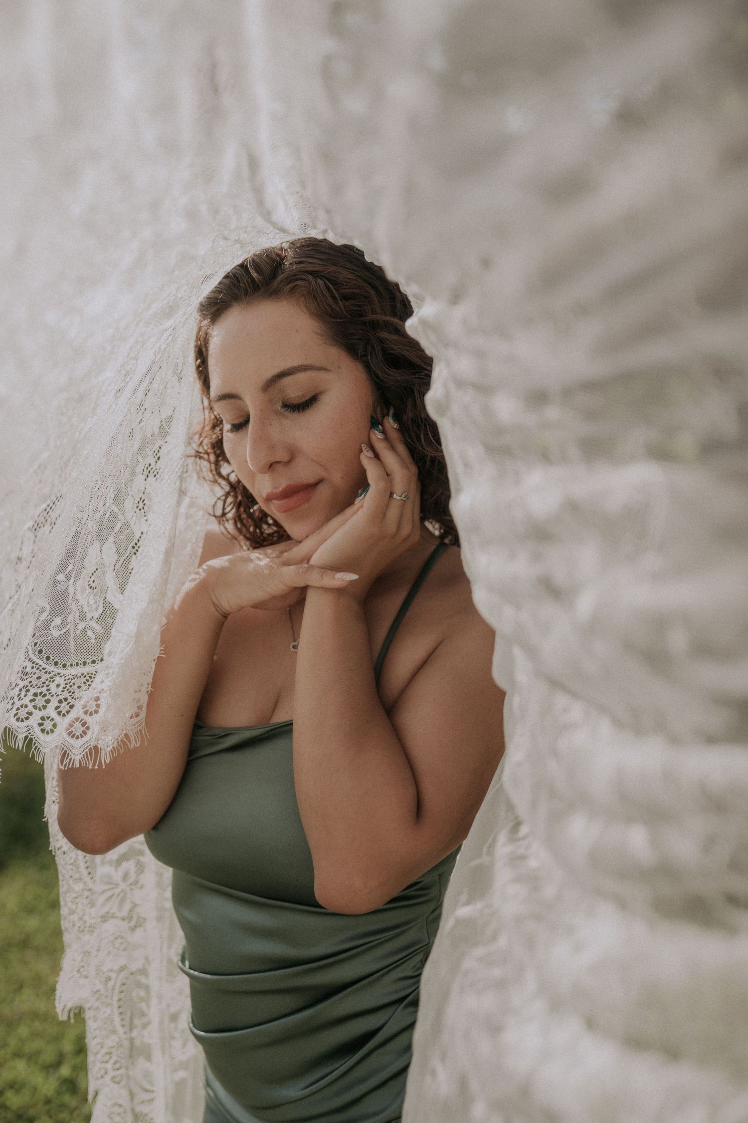 Artistic veil portrait with delicate lace details.