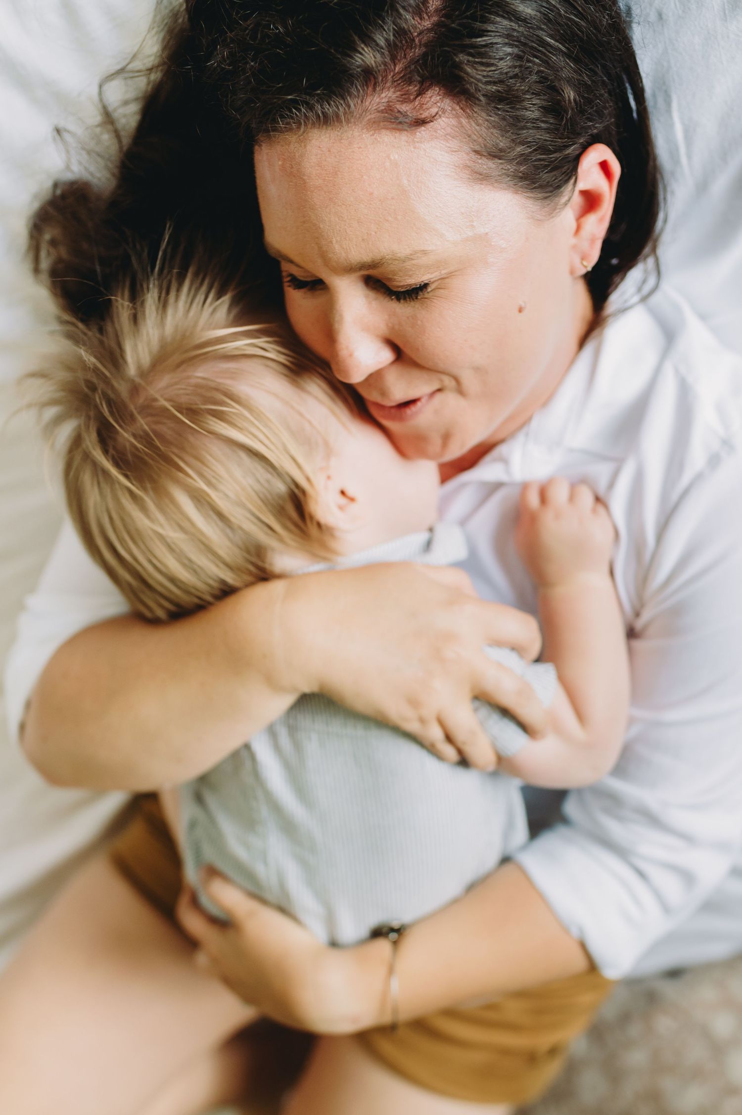 Tender moments captured in a series of intimate black and white photographs showing gentle embraces.