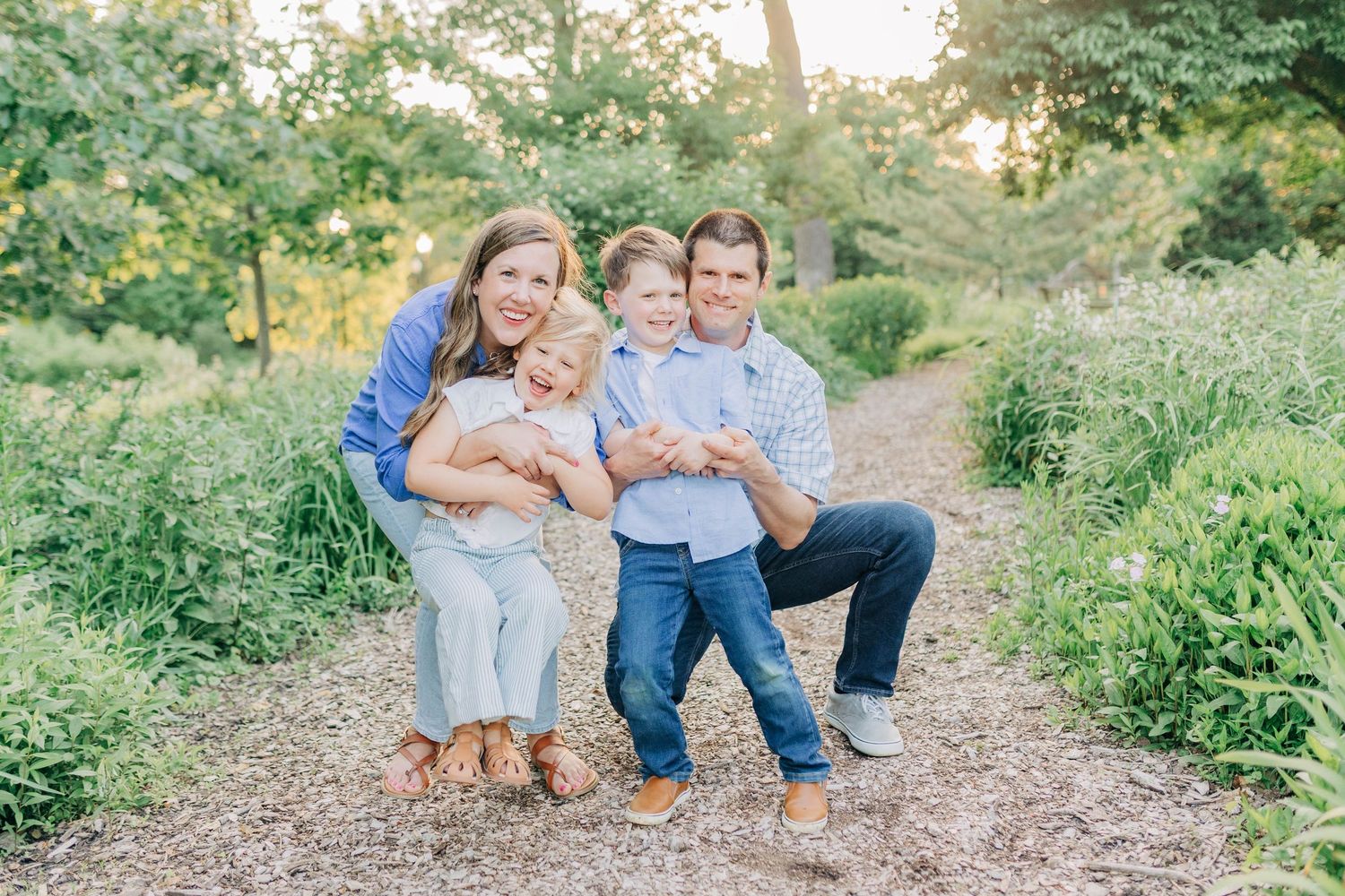 Candid family moments captured on a nature trail during golden hour.