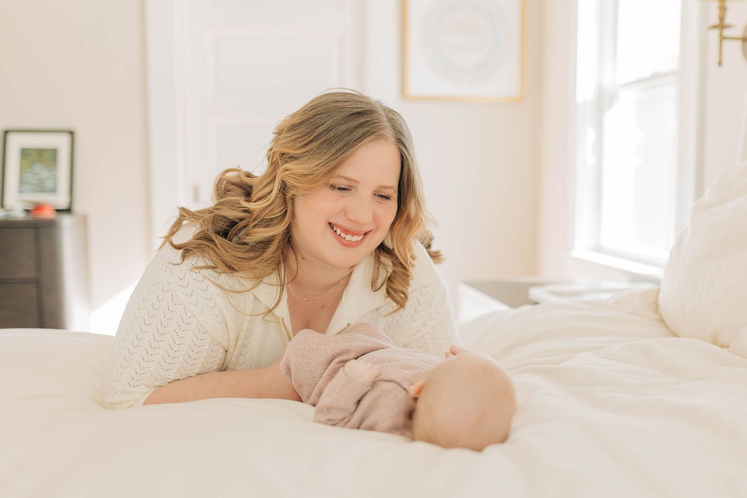 Bright and airy lifestyle photos of family moments in a white room.