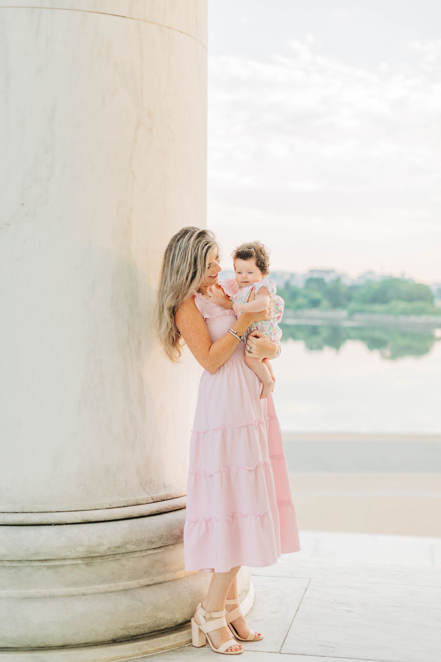 Intimate portrait session by the marble columns of the Jefferson Memorial.