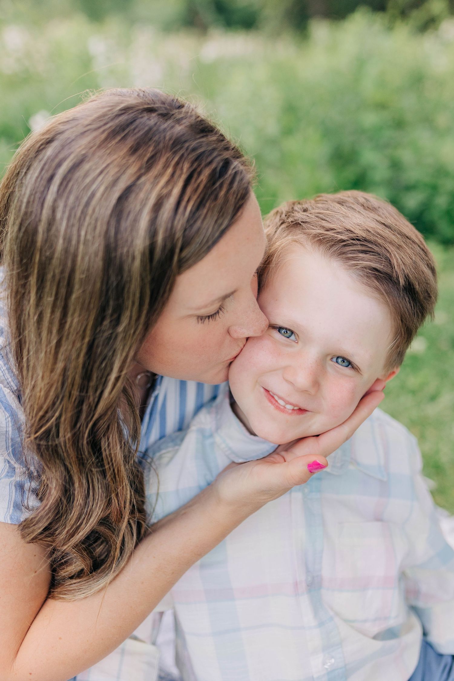 Tender embraces captured during an intimate outdoor portrait session.