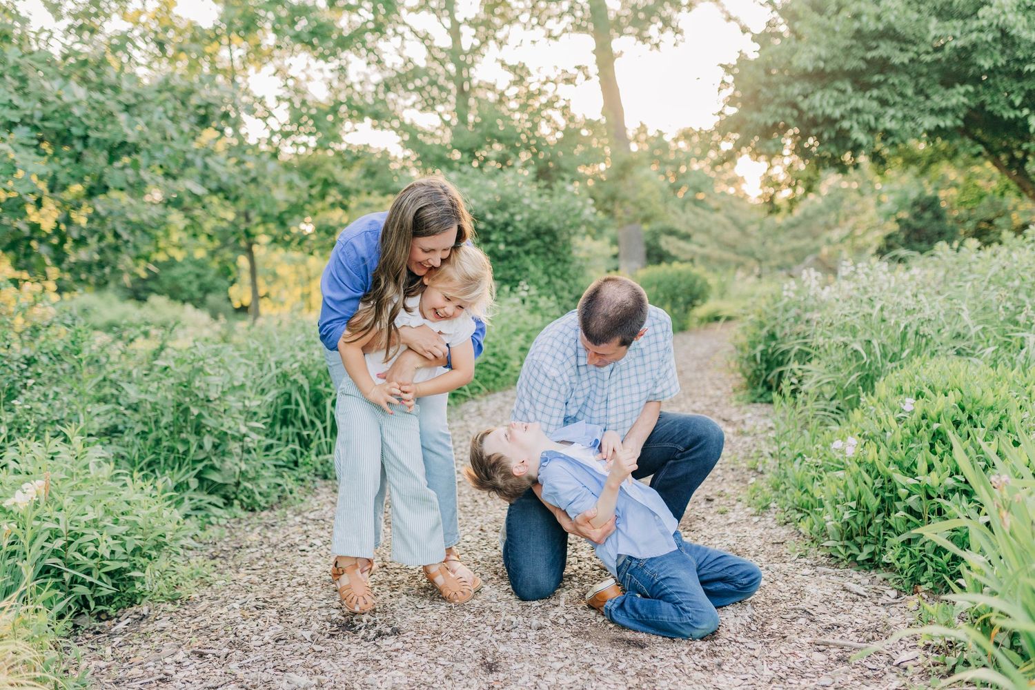 Family spending quality time together on a rustic woodland path.