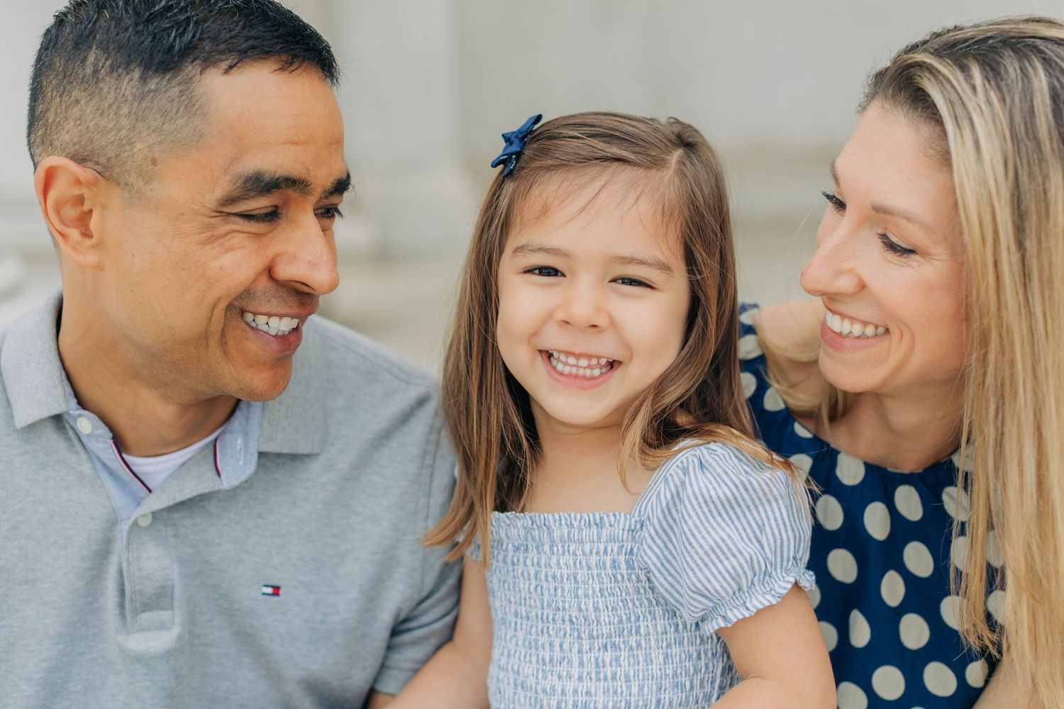 Family portrait series showing joyful interactions and laughter outdoors.