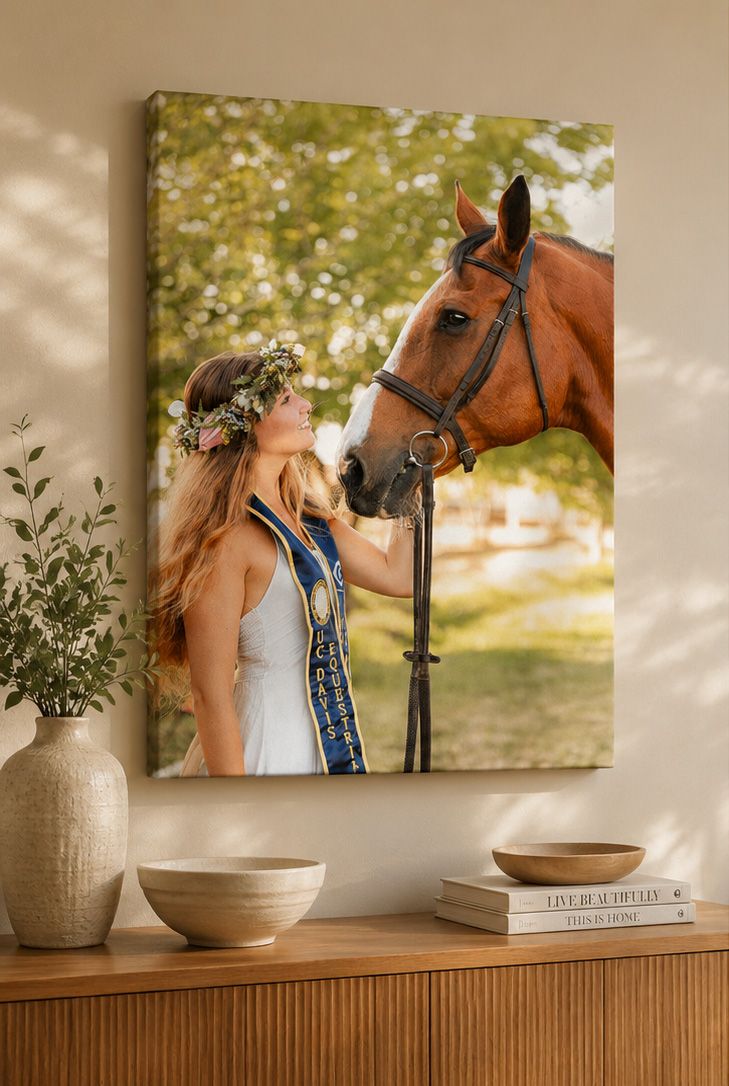 Canvas wall art of a blonde woman in white dress with flower crown kissing a chestnut horse.