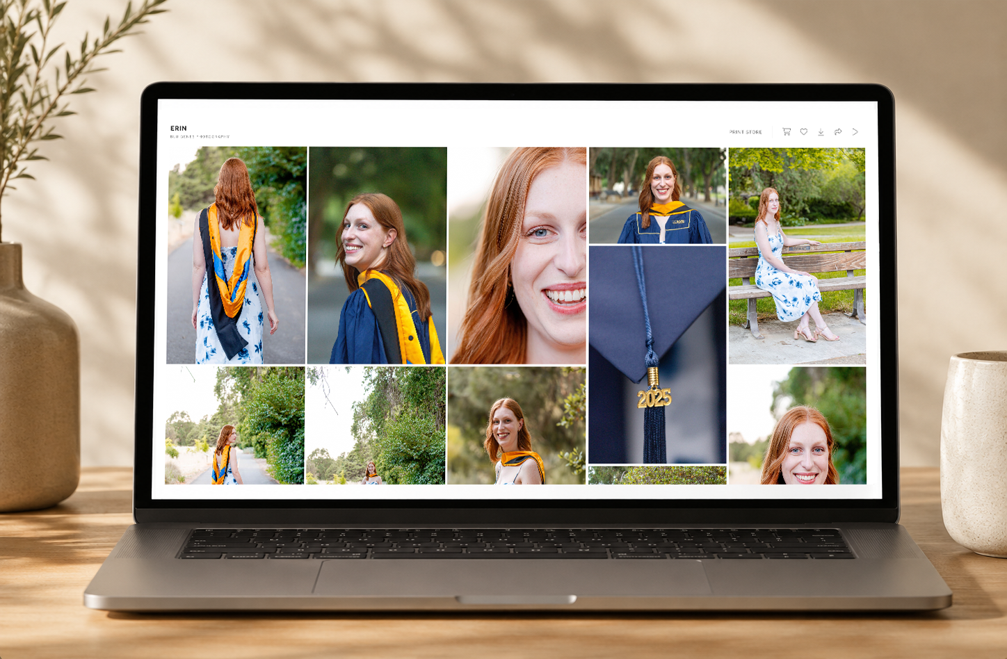 A laptop displaying a photo gallery of a young woman in graduation attire, featuring multiple outdoor portrait shots.