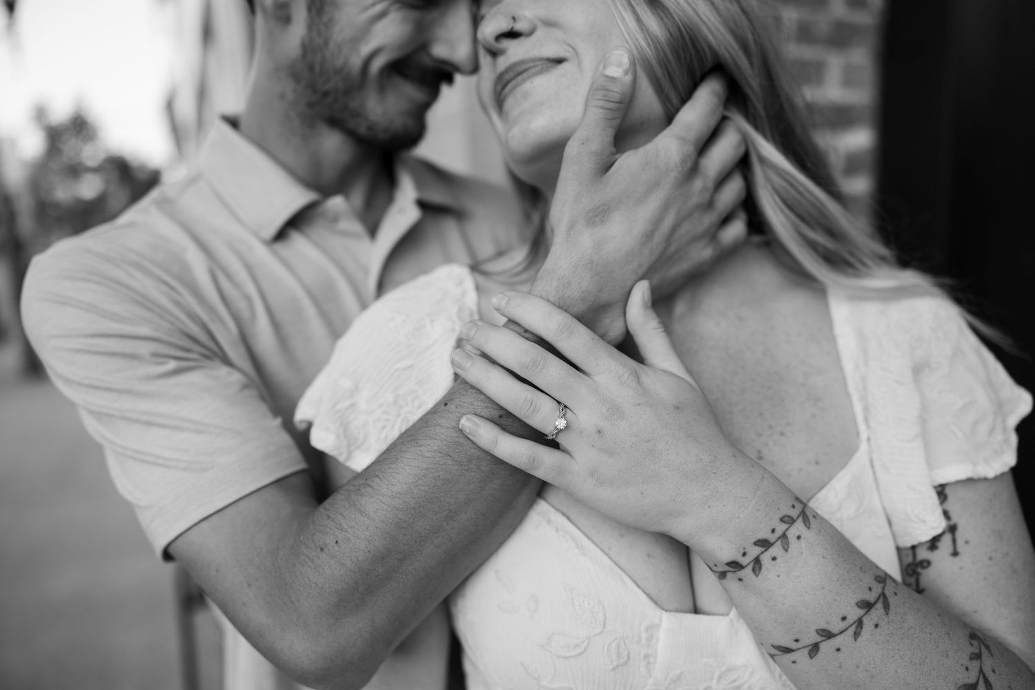 Series of intimate black and white photos showing tender couple moments.