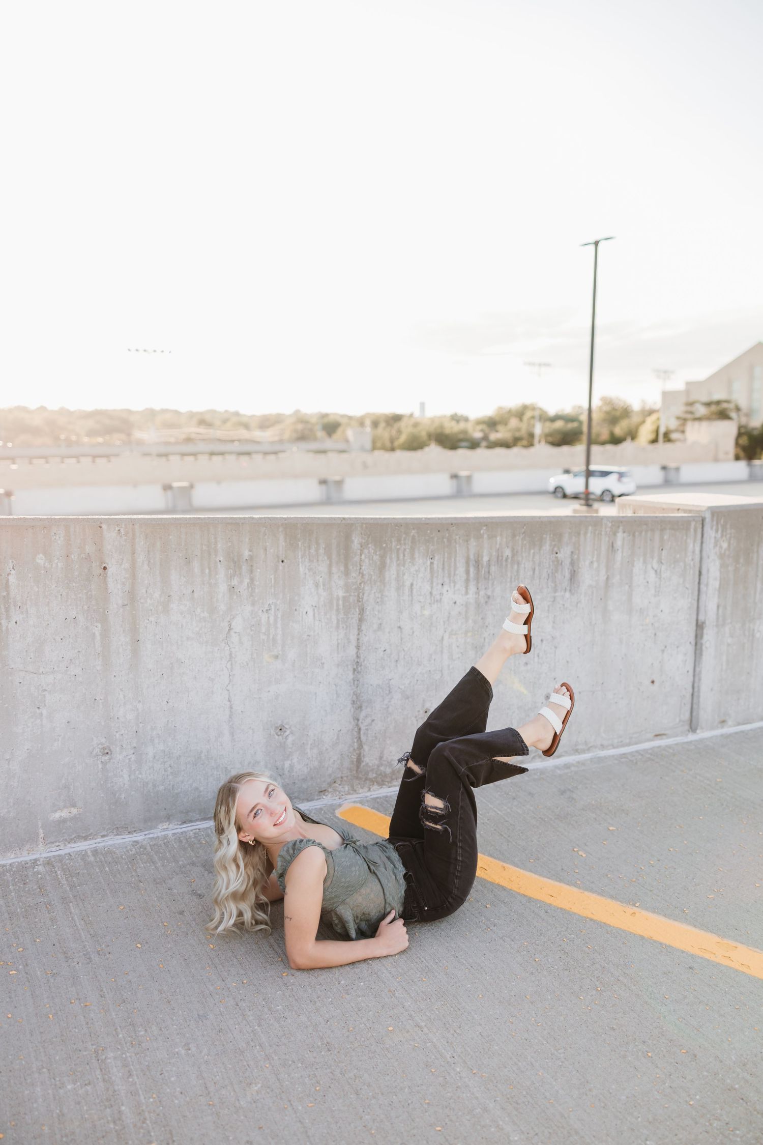 Creative photo series on concrete ground of a parking garage.