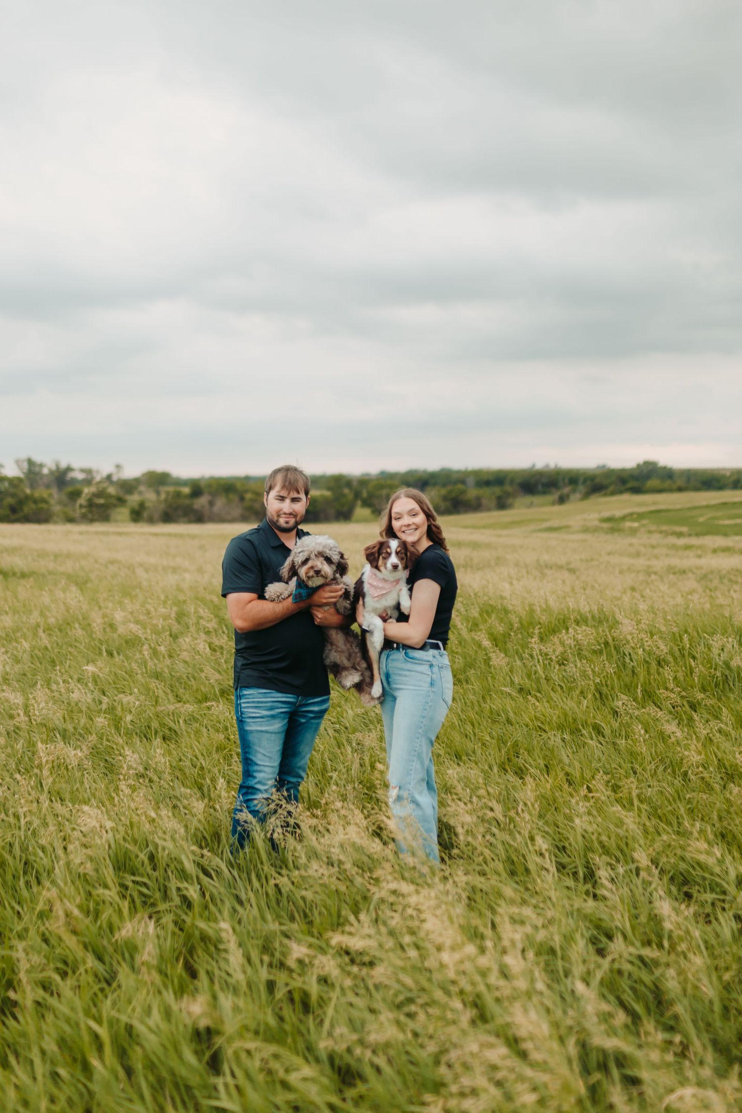 Happy couple with their dogs.