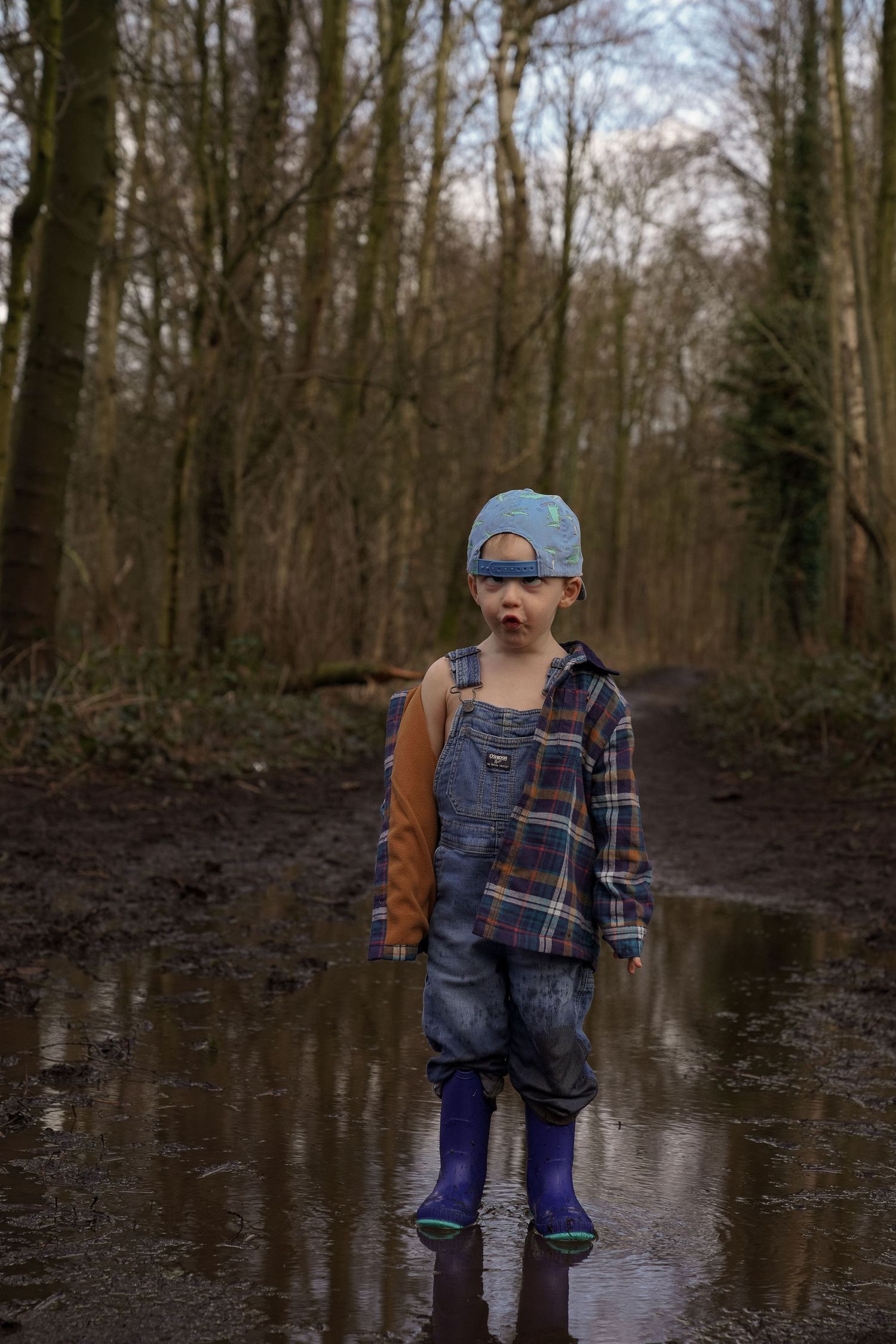 muddy session with son in overalls