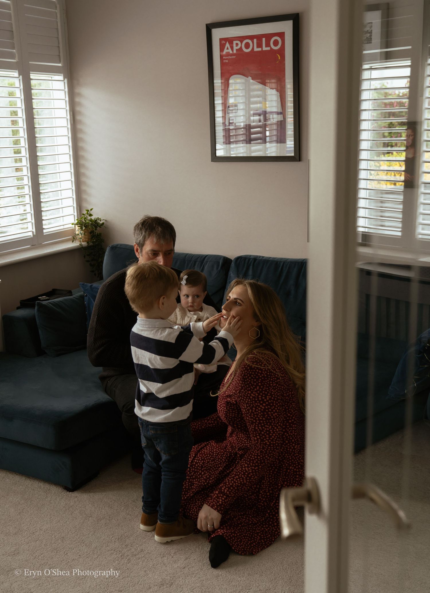 family of 4 playing in room