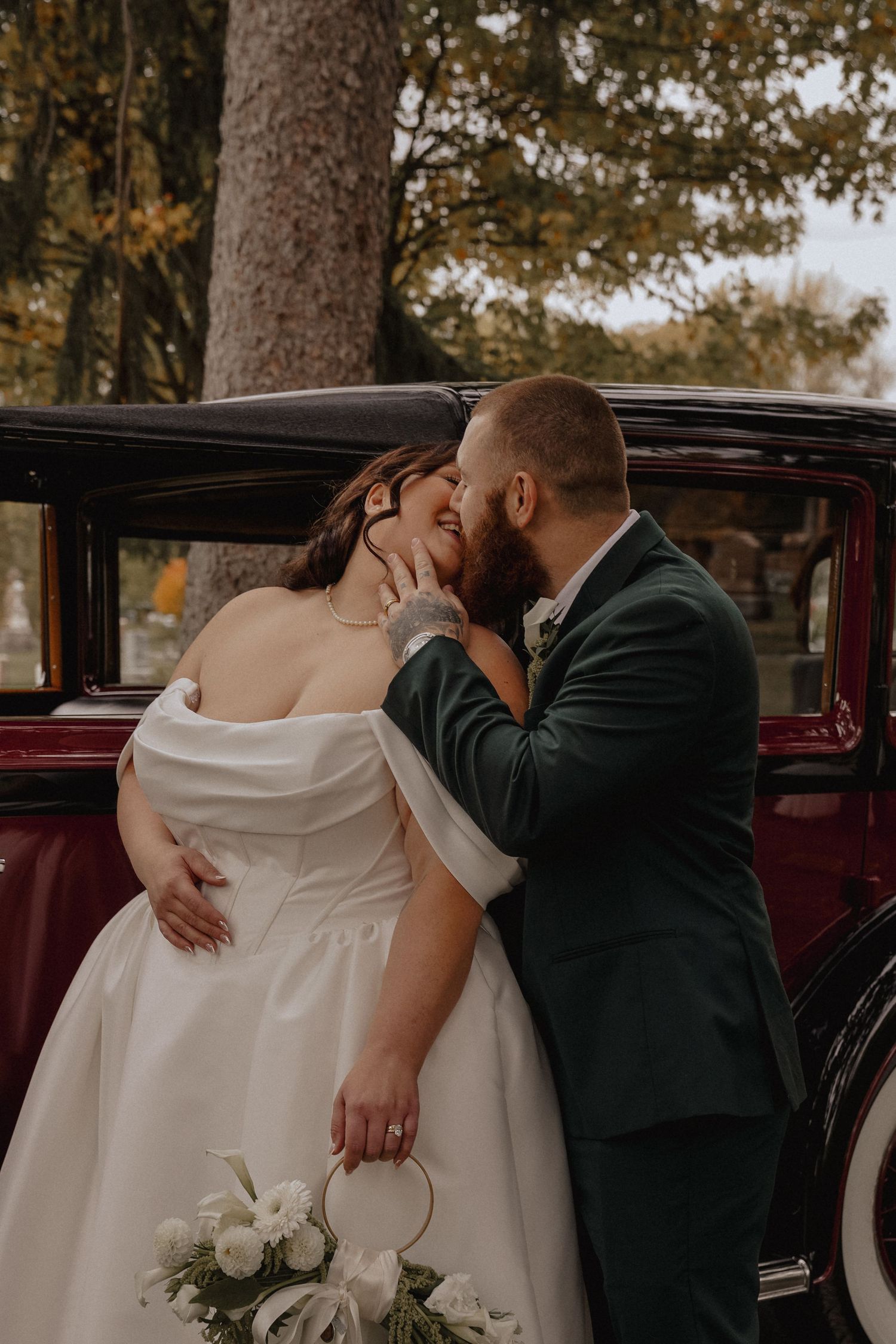 bride and groom infant of car