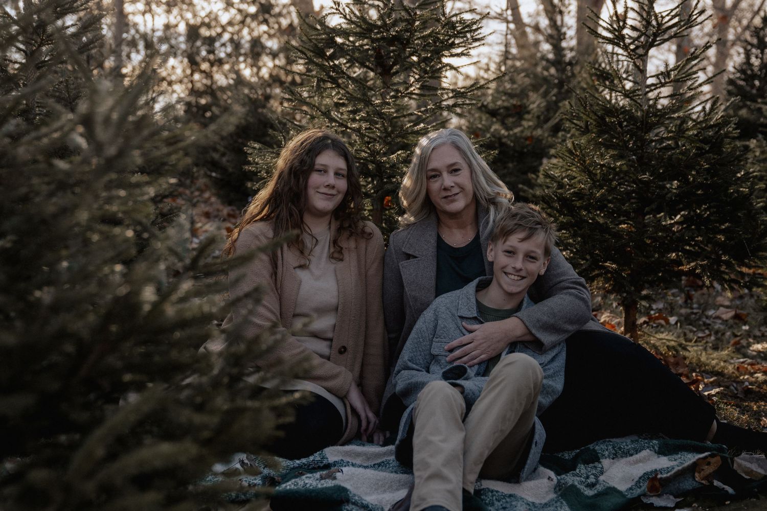 Family at Christmas tree farm