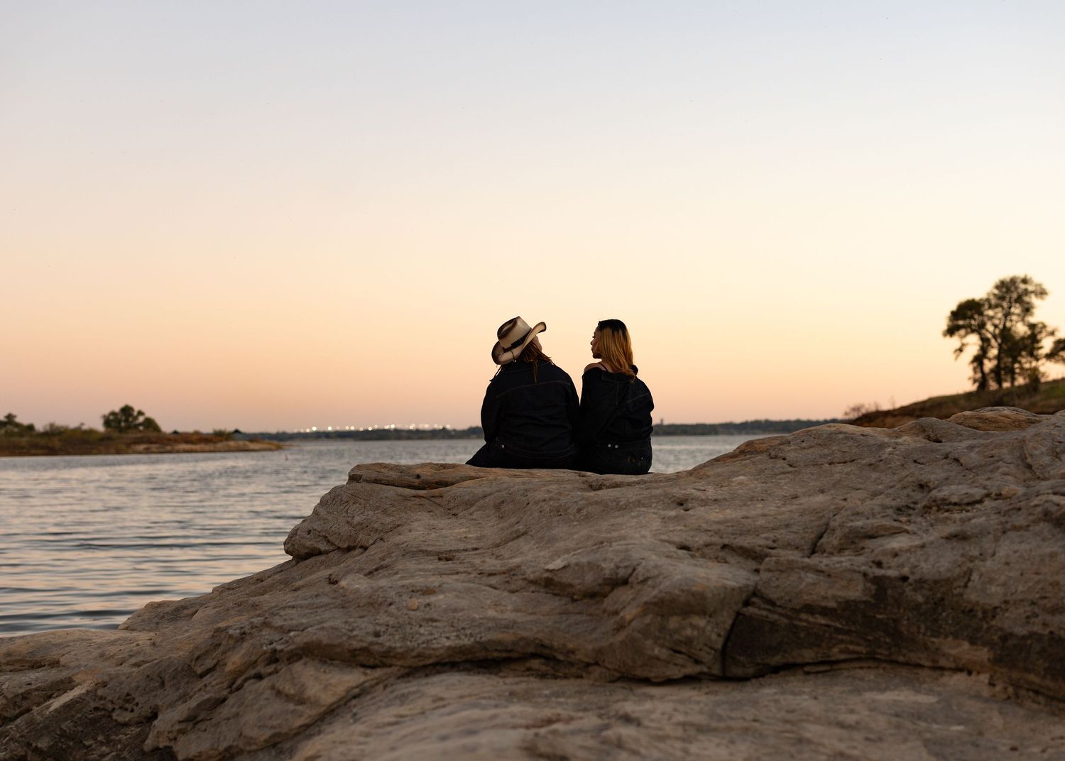 Scenic coastal landscape with rocky formations during sunset.