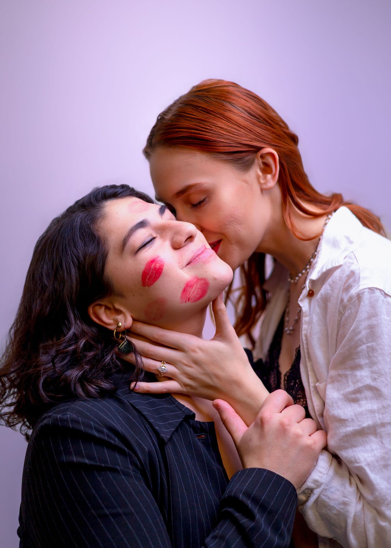 Two people share intimate moments in a series of romantic poses against a purple backdrop.