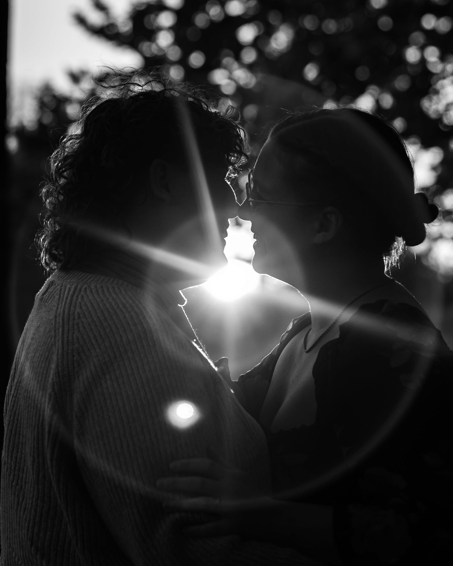 Silhouetted figures in dramatic backlit sunset portraits.