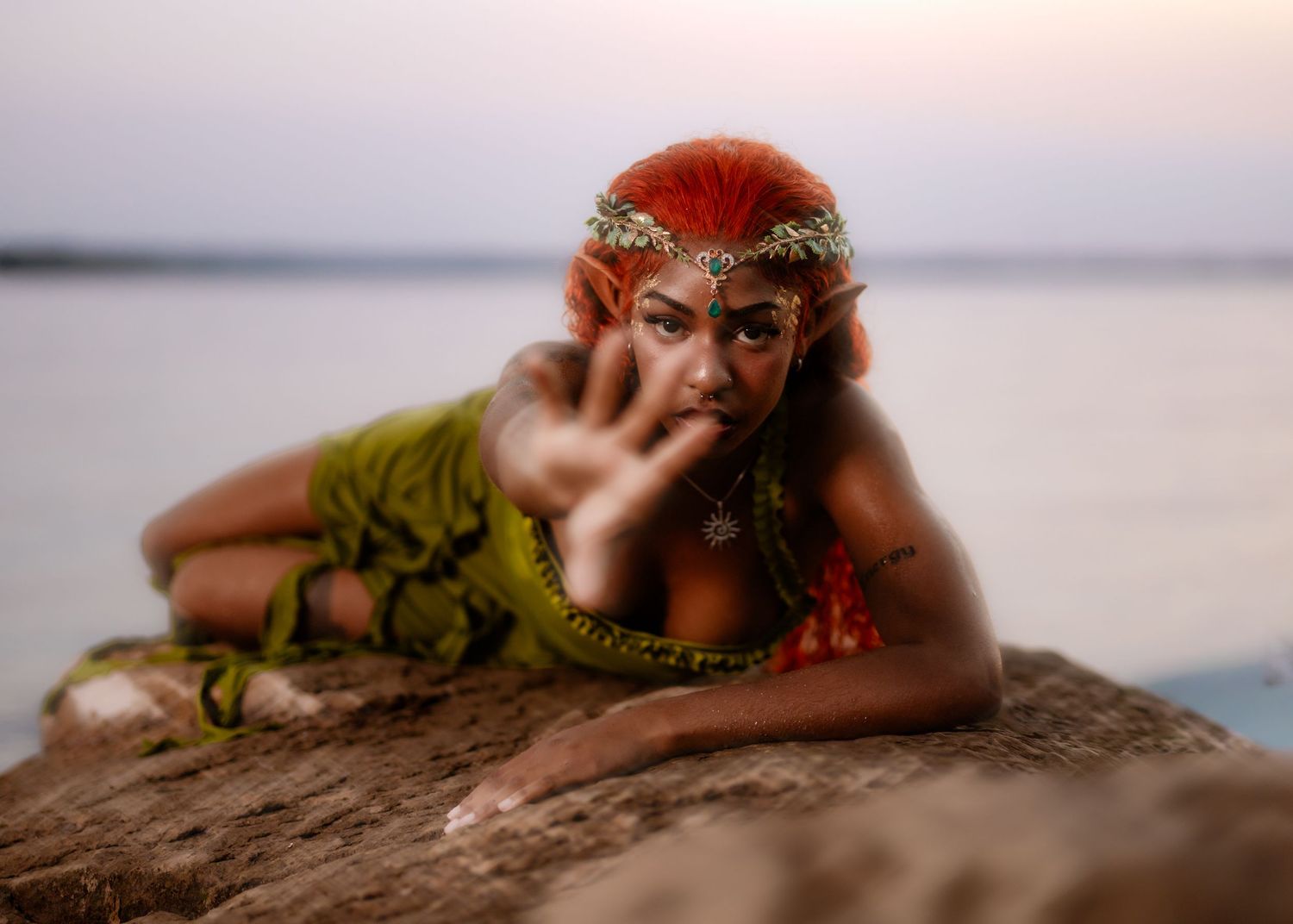 Artistic portrait series featuring ethereal water and beach elements with dramatic lighting and flowing fabrics.