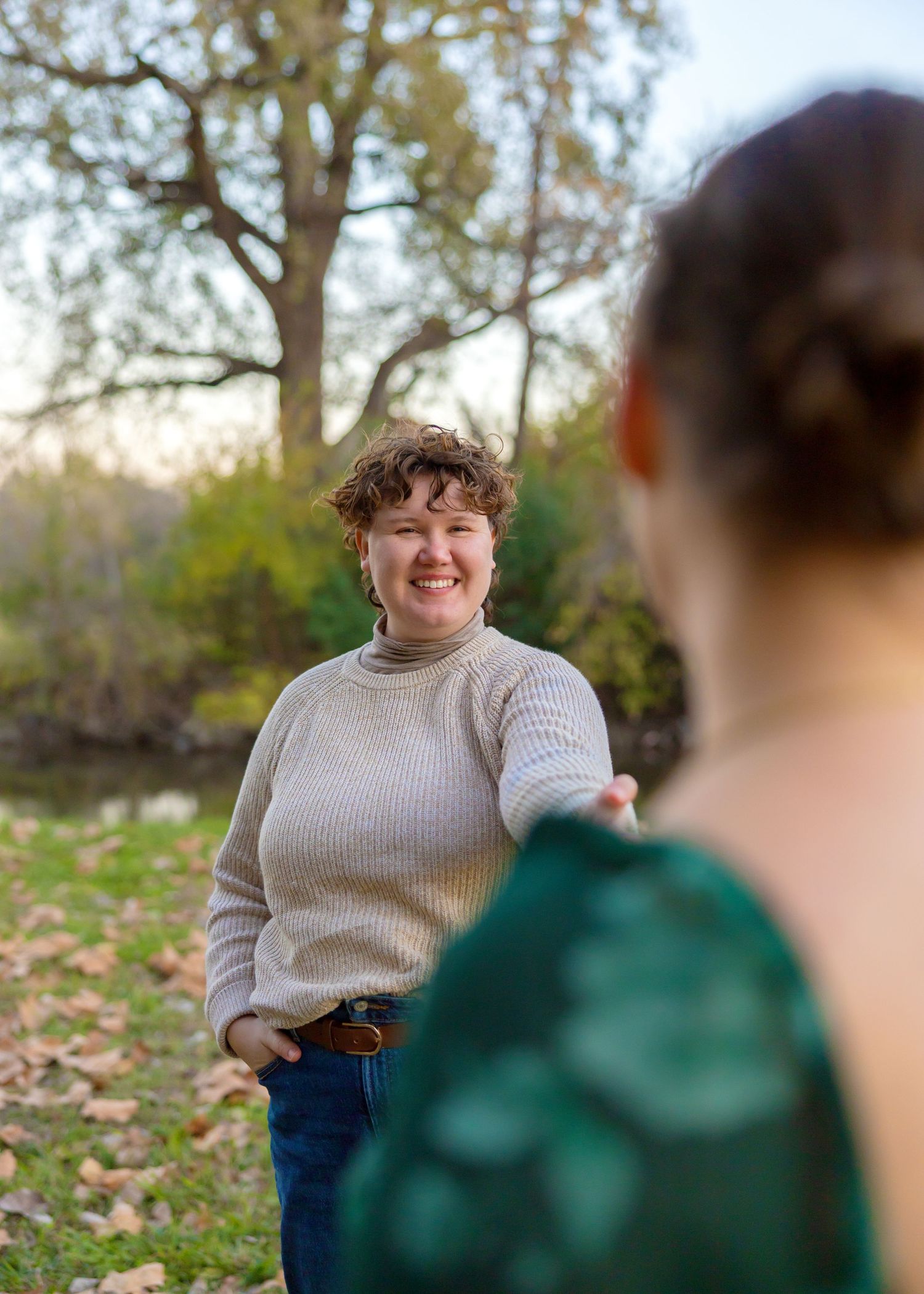 Casual outdoor portrait sequence showing genuine laughter and connection between two people.