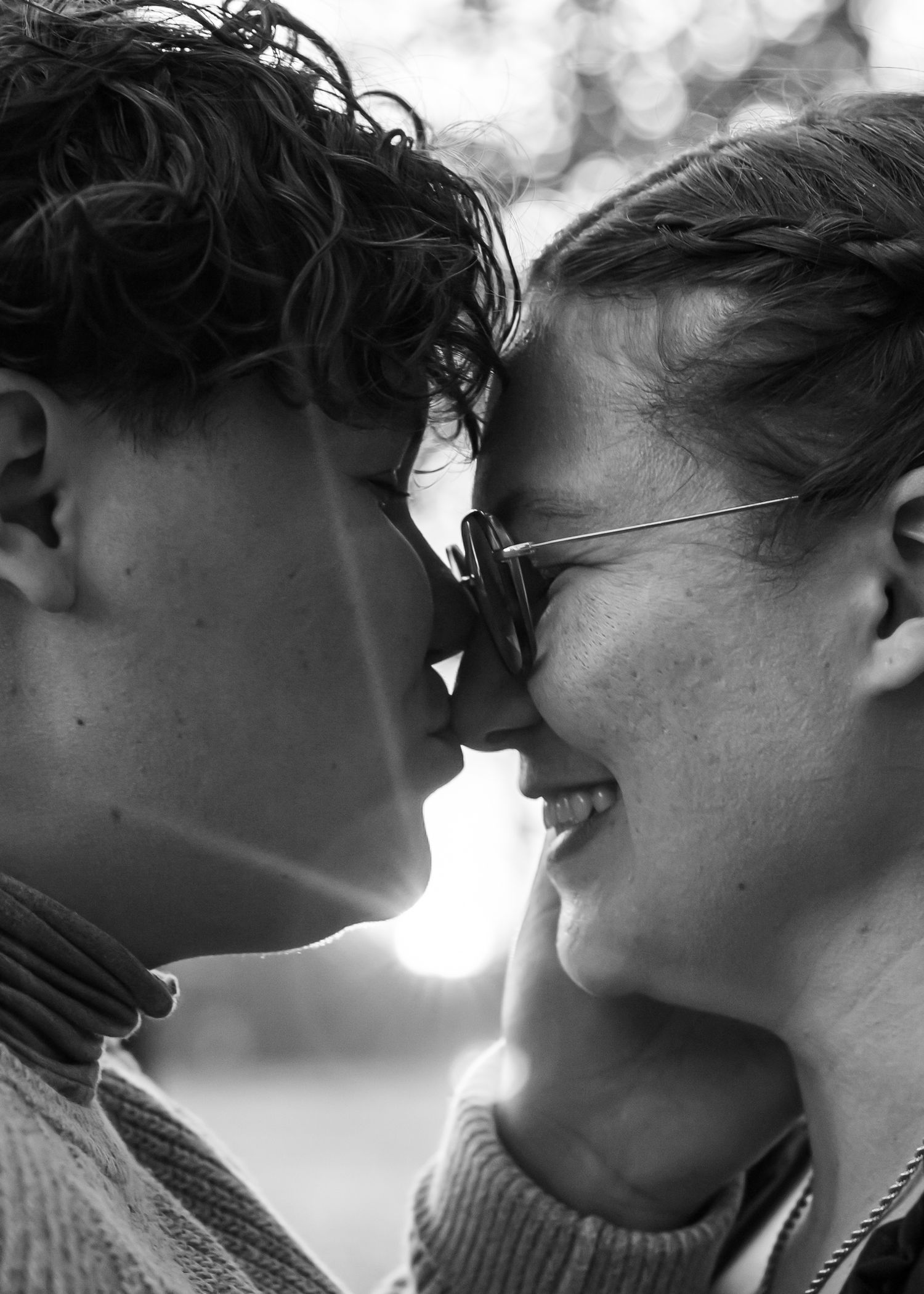 Black and white close-up sequence of a tender romantic moment between two people.