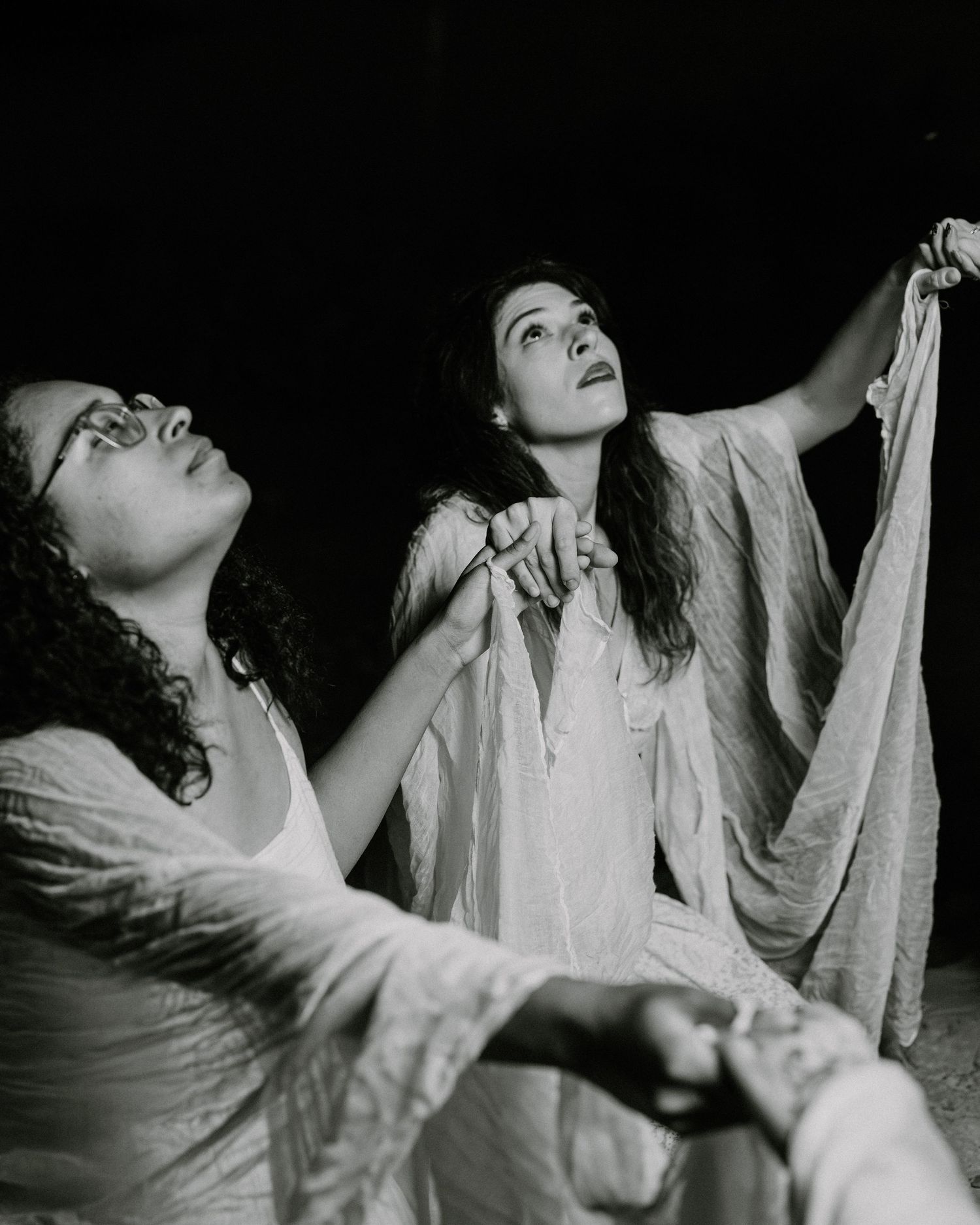 Dramatic black and white photo series capturing expressive dance movements in low light conditions.
