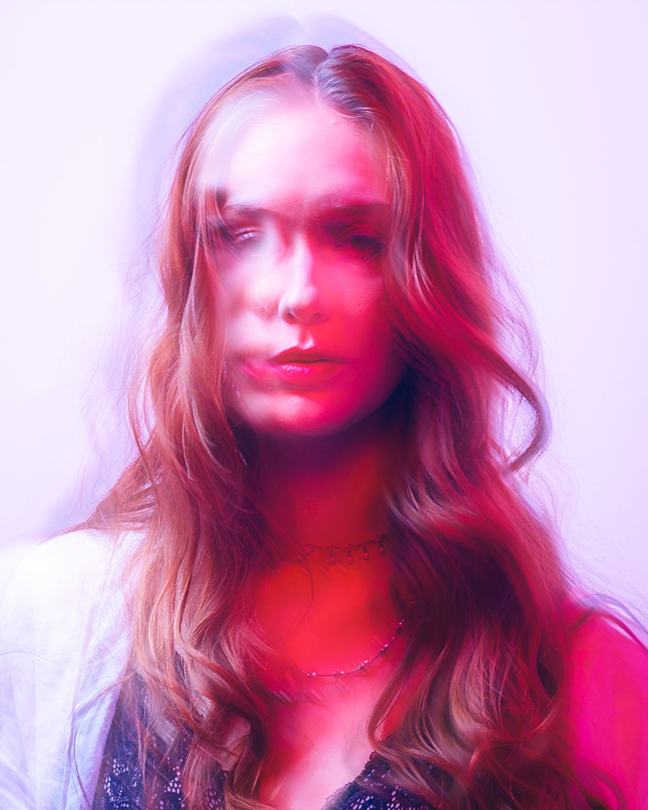 A series of four artistic portraits with red lighting effects and soft focus creating a dreamy, ethereal atmosphere.