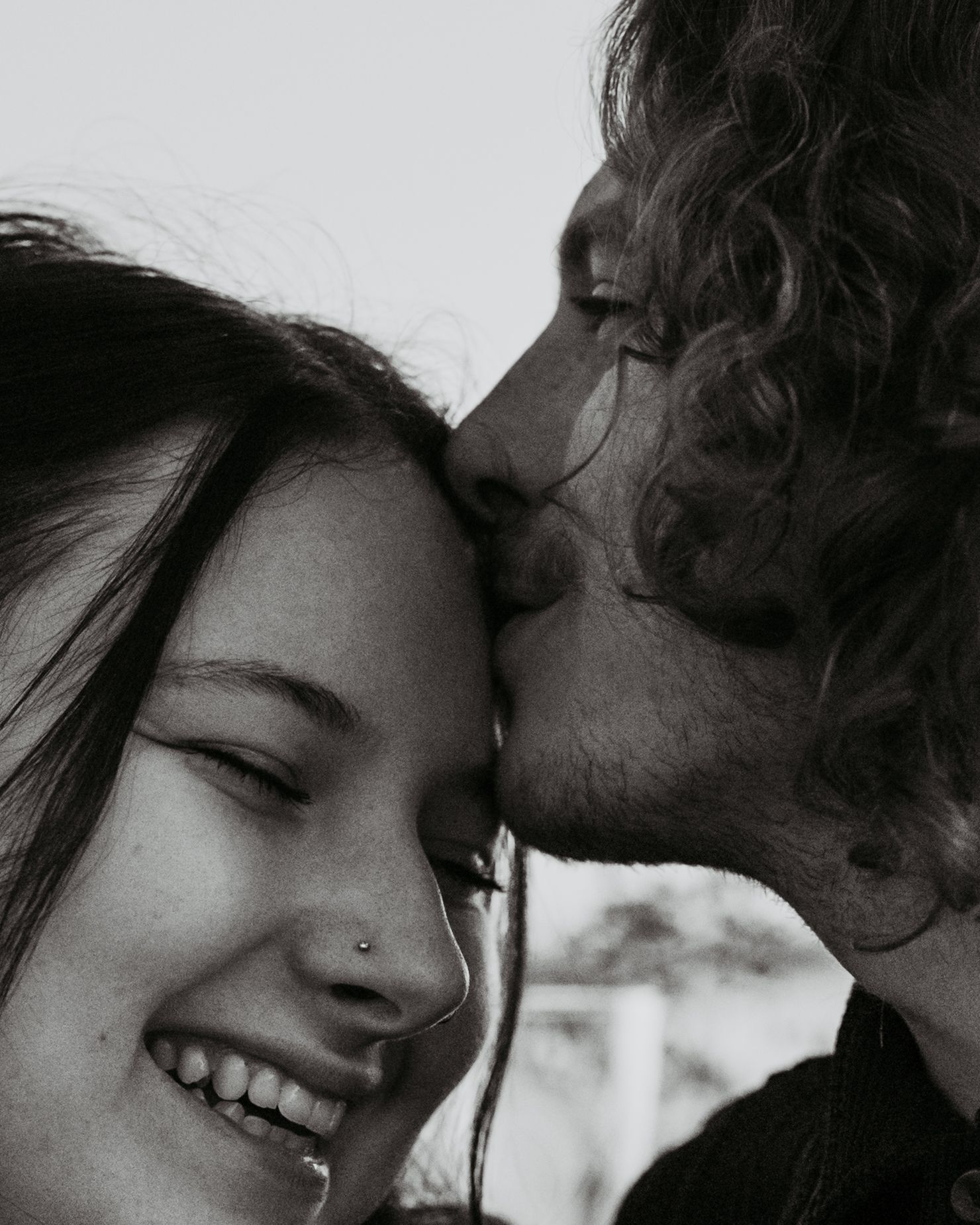 Intimate black and white close-up of a tender romantic moment.