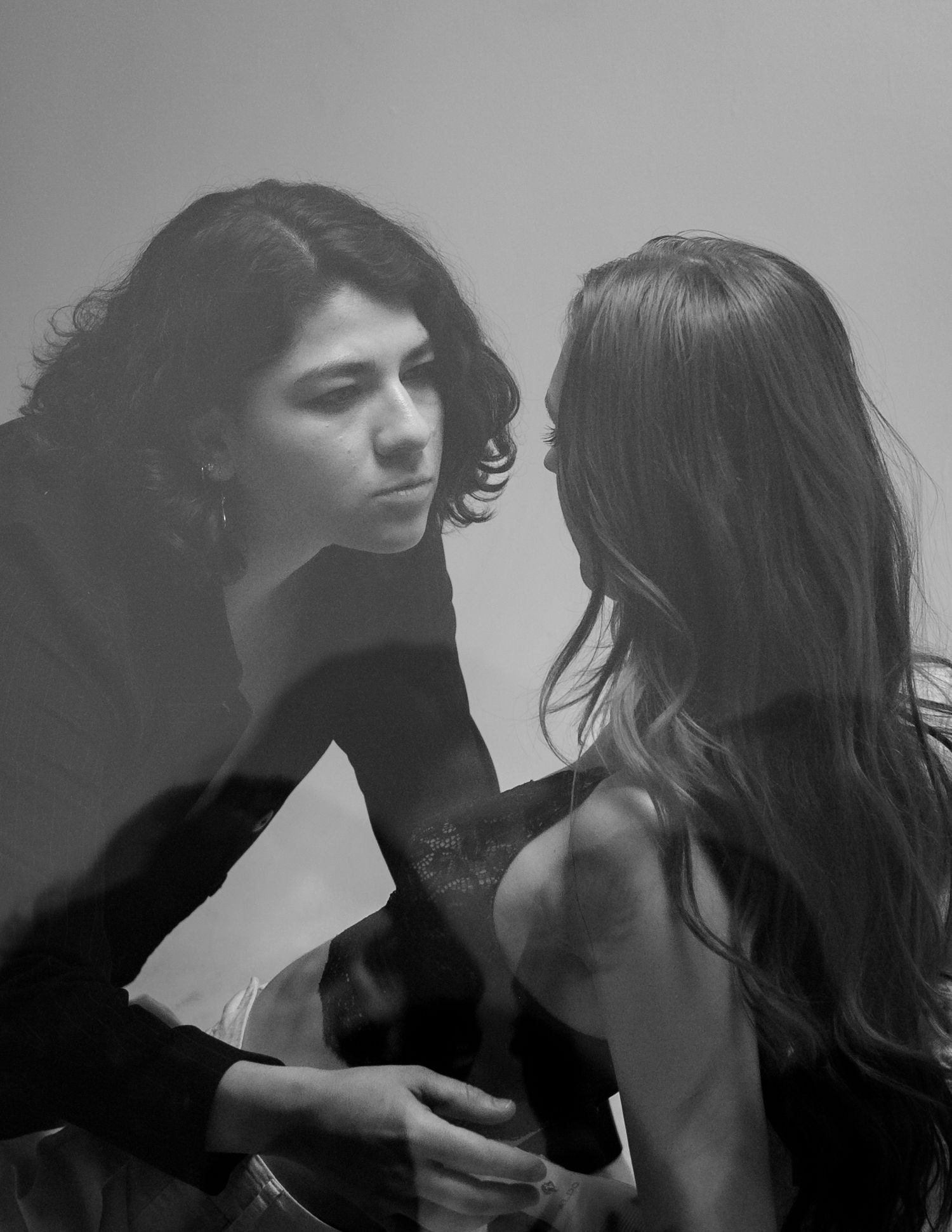Moody black and white photo series capturing intimate moments between two models.