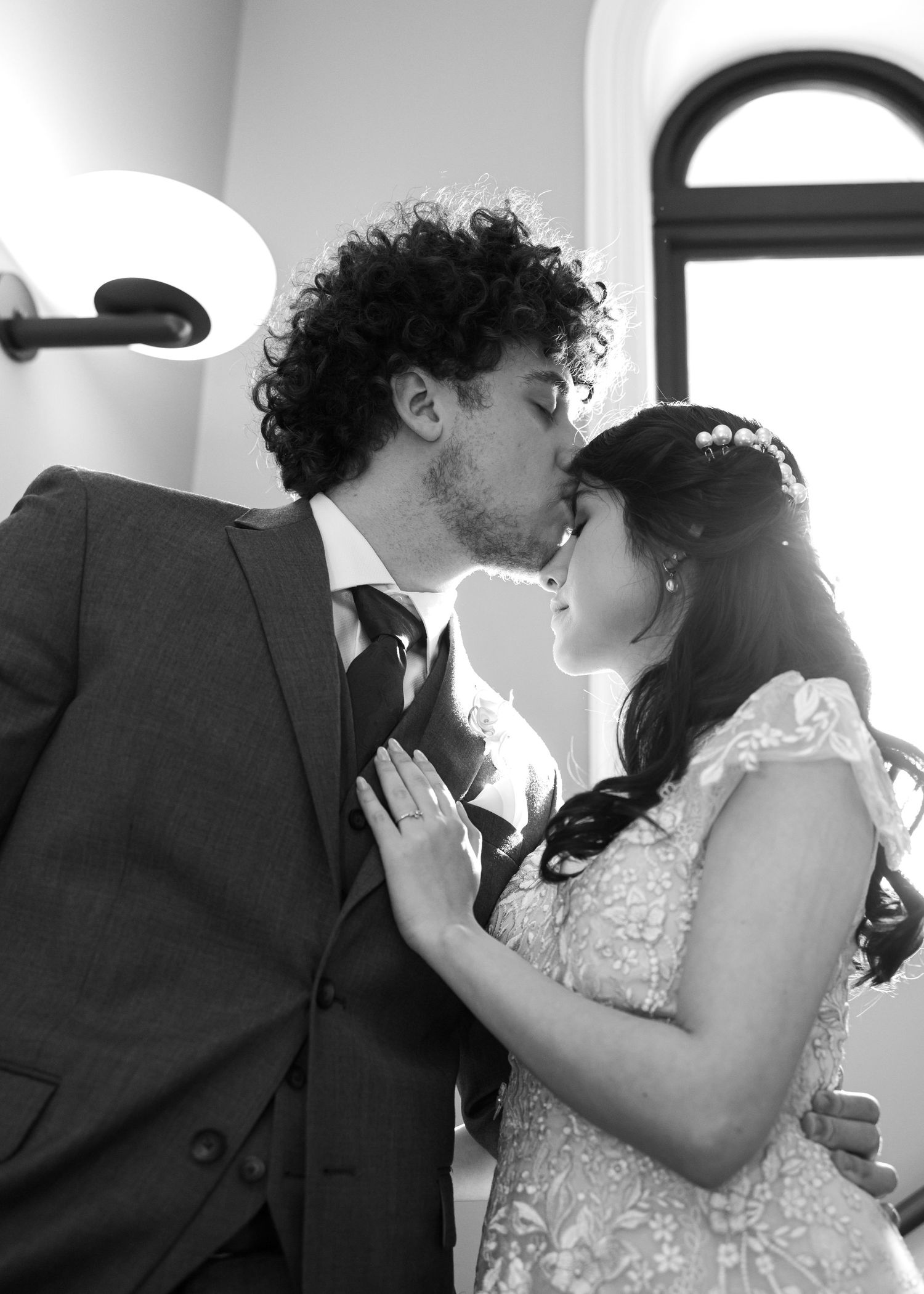 Black and white sequence of romantic dance poses in an indoor setting.
