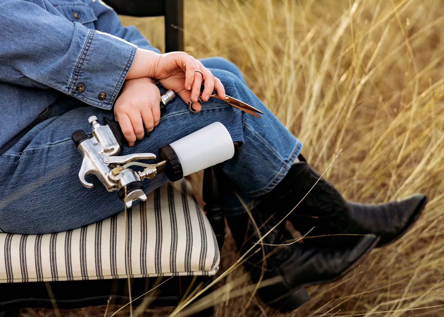 Artistic photography angles of someone relaxing on a chair with camera gear.