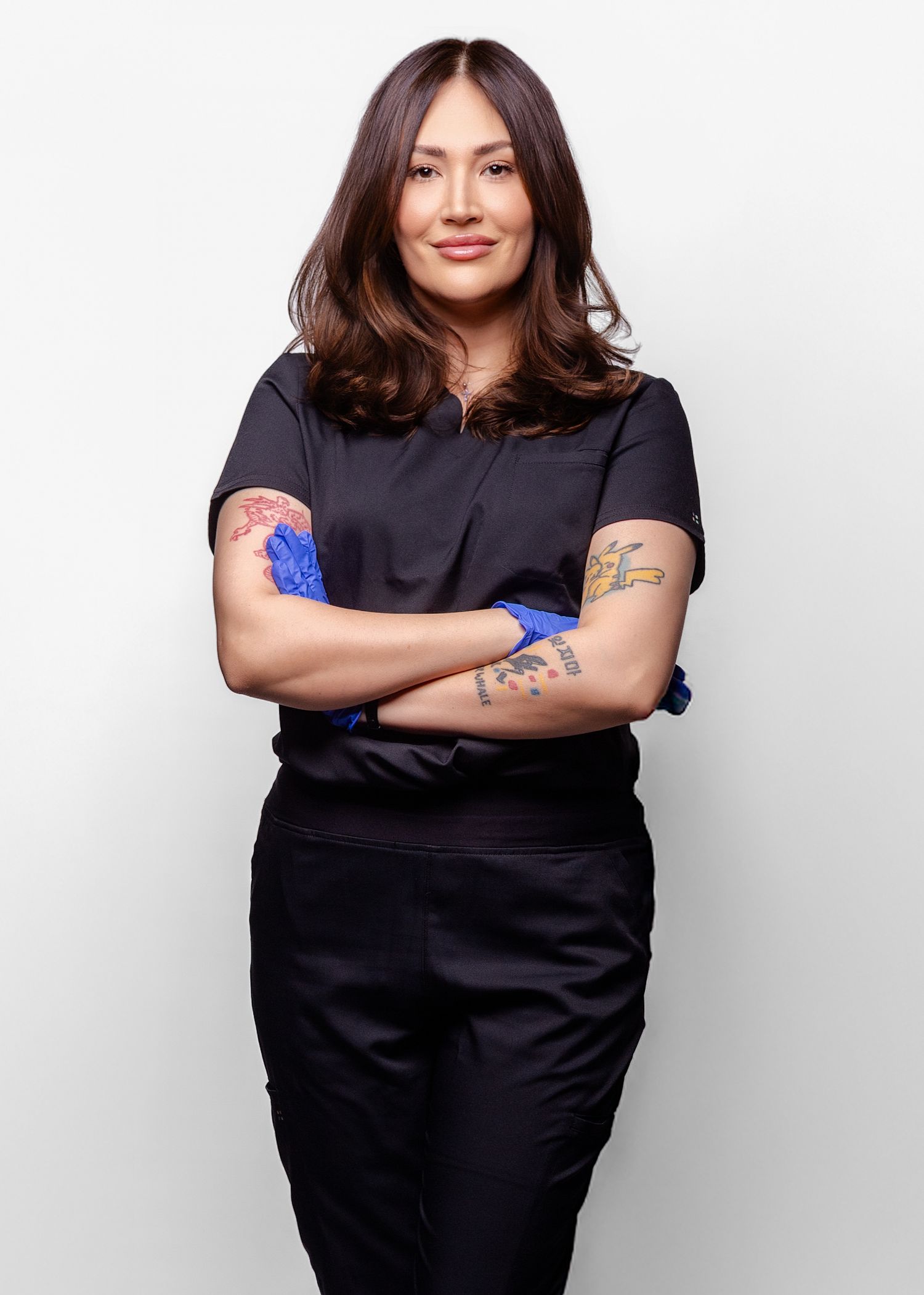 A person in a black outfit poses in four different casual stances against a white background.