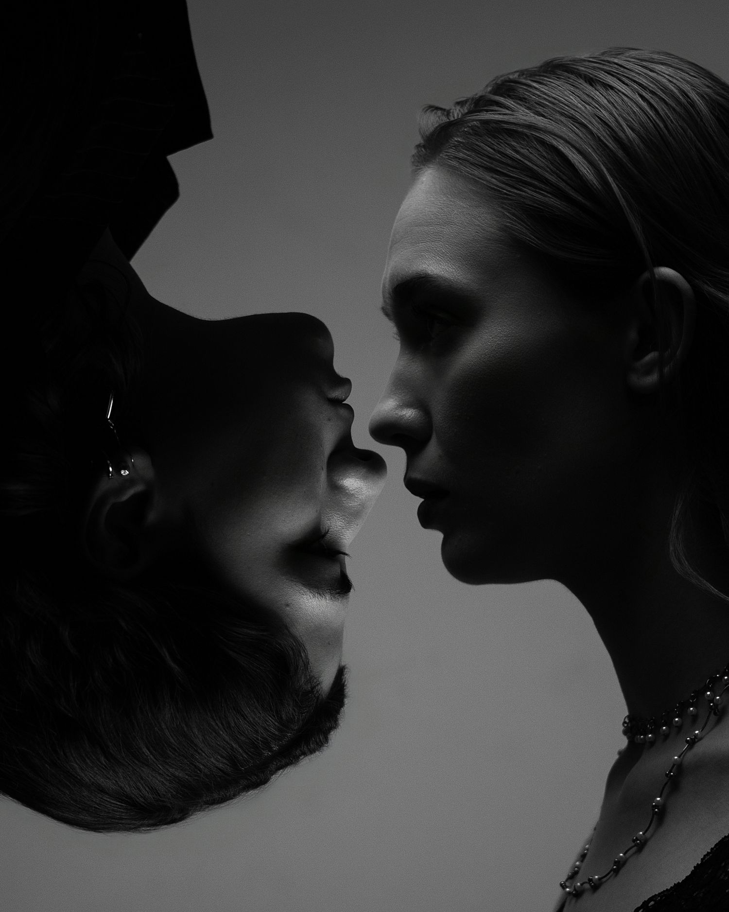 Dramatic black and white silhouette profile shots showing intimate moments between couples in shadow against gray backgrounds.