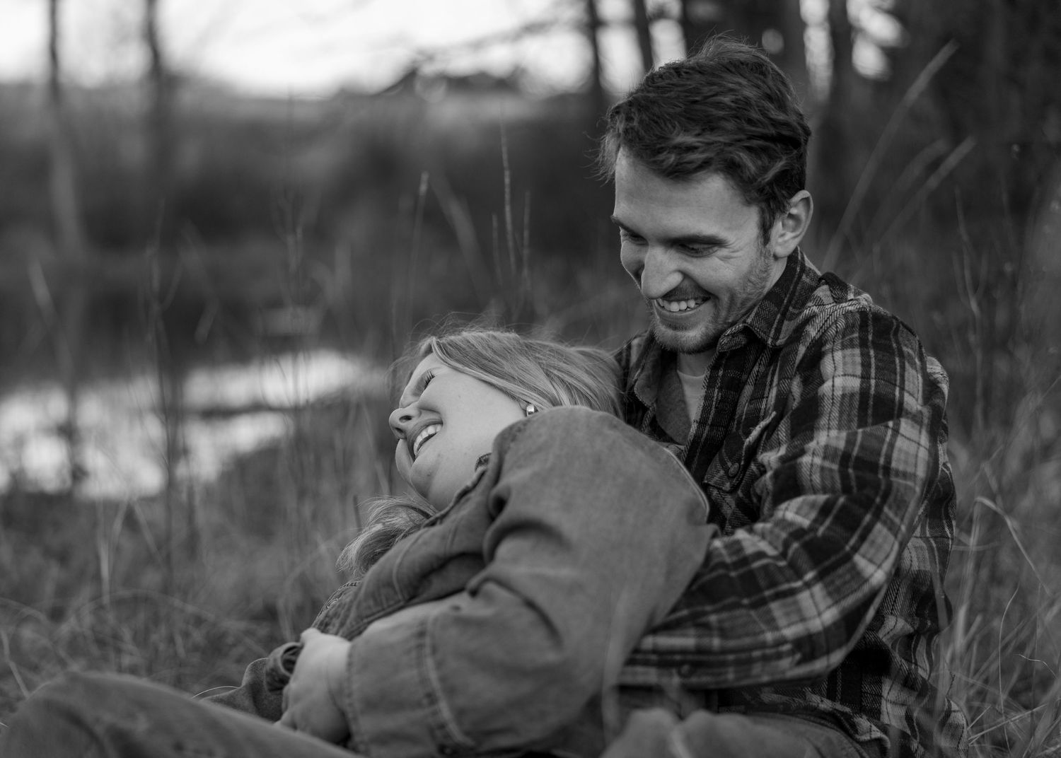 Black and white intimate portrait session in natural setting.