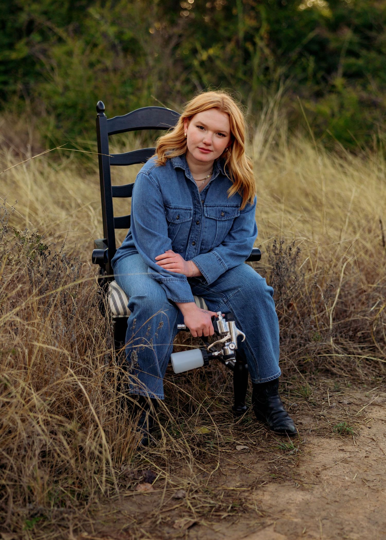 Casual outdoor portrait session featuring denim outfit and photography gear.
