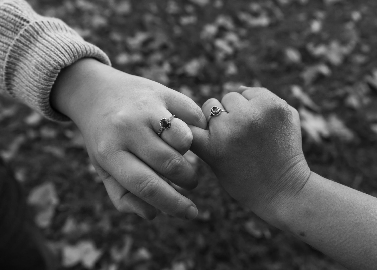 Black and white detail shots of hands touching and connecting.