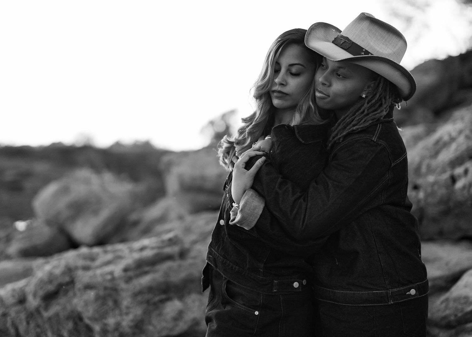 Black and white candid shots of couple sharing joyful moments outdoors.