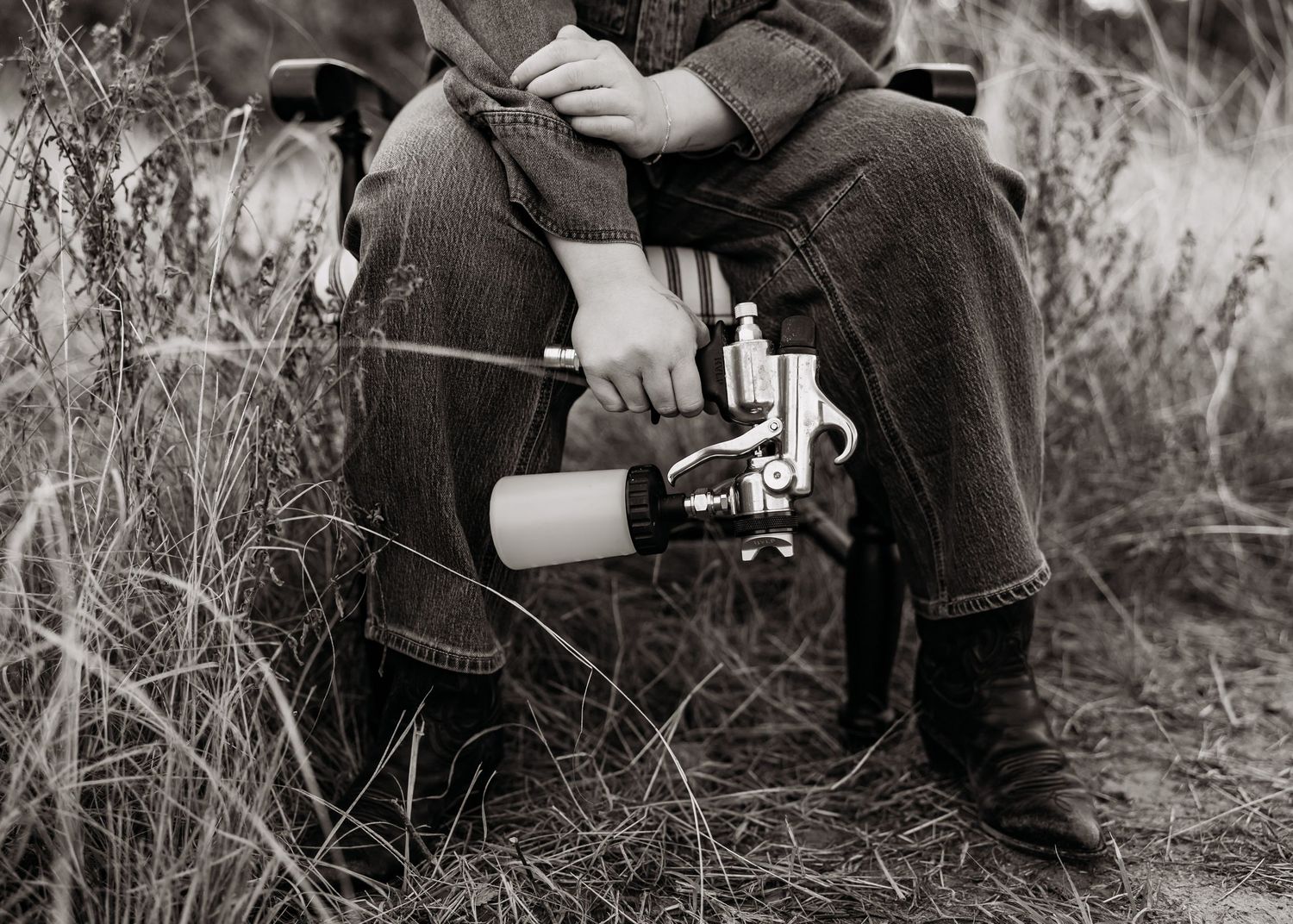 Black and white series of someone photographing with vintage camera equipment.