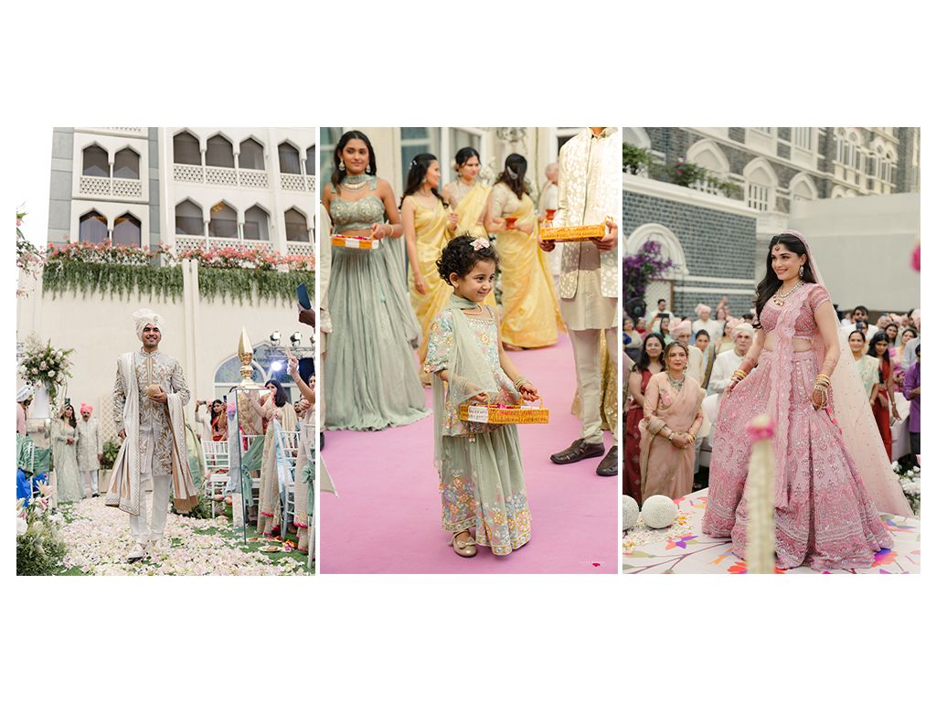 Wedding bridesmaids in mint and yellow lehengas walking down a floral-decorated aisle at an Indian wedding.