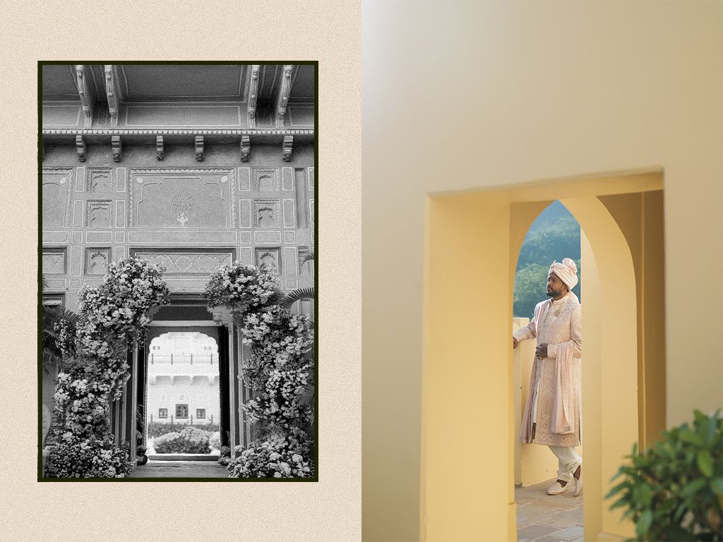 Ornate Indian palace archway adorned with white flowers and groom in ivory sherwani framed in golden archway.