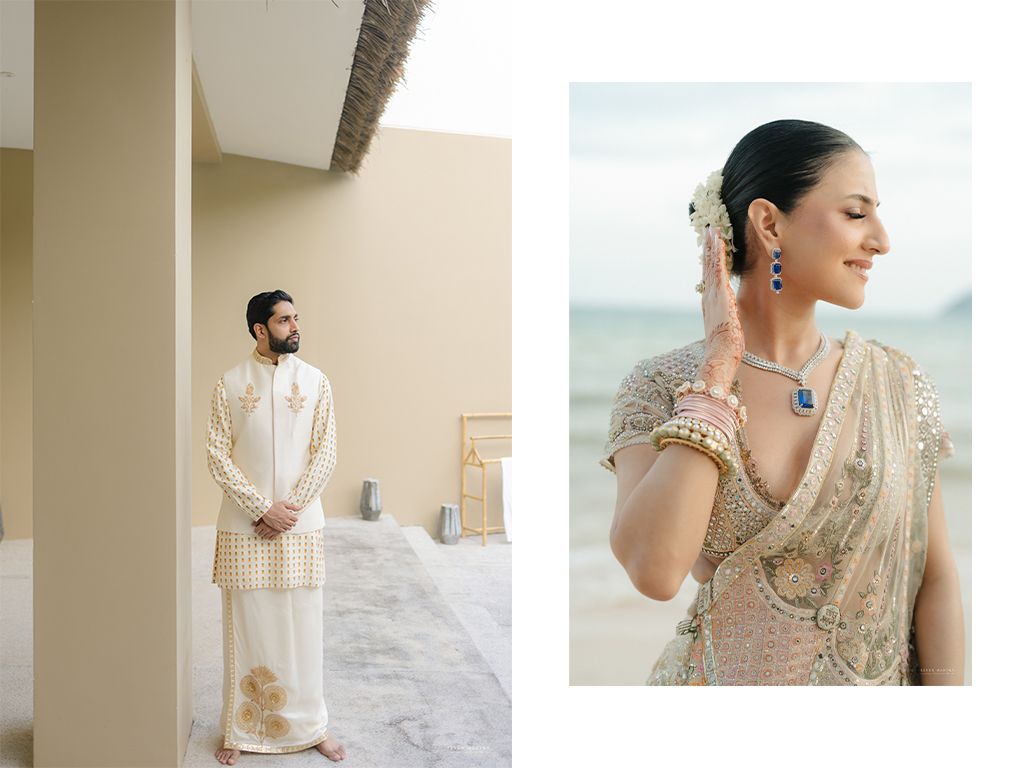Groom in ivory sherwani and bride in embellished lehenga with sapphire earrings at beachside Indian wedding.