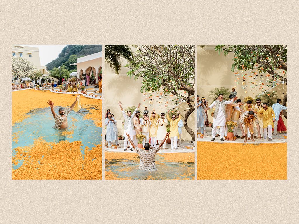 Wedding guests toss marigold petals in pool and grounds during vibrant outdoor haldi celebration.