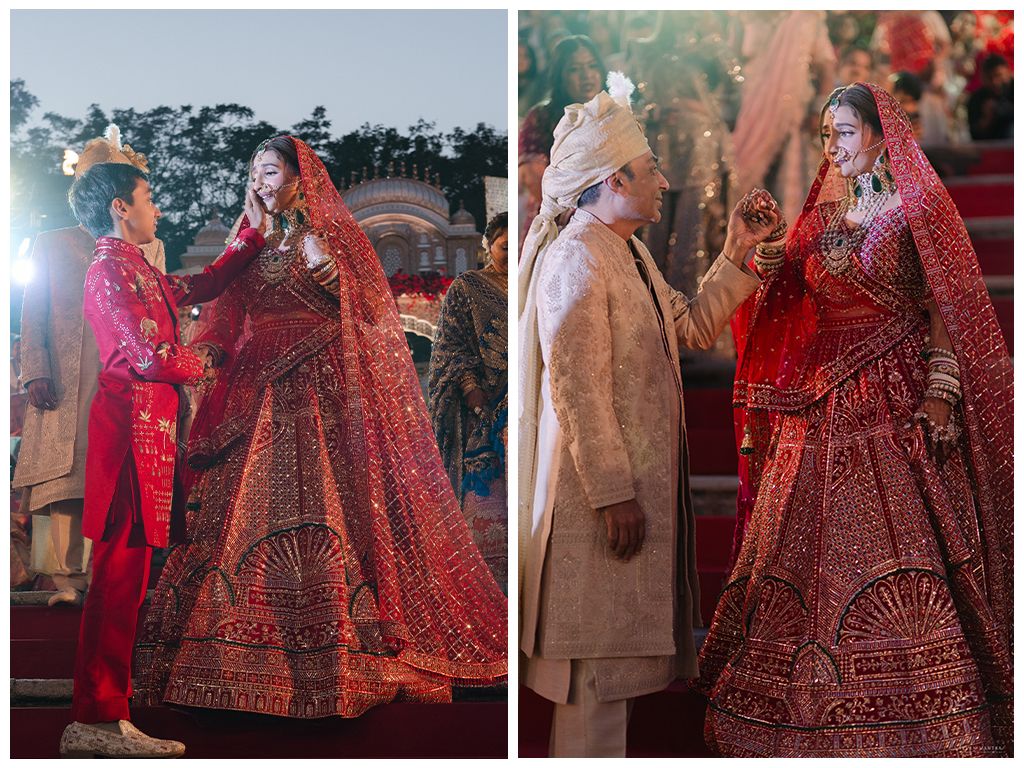 Indian bride in stunning red embroidered lehenga with groom during traditional wedding ceremony.
