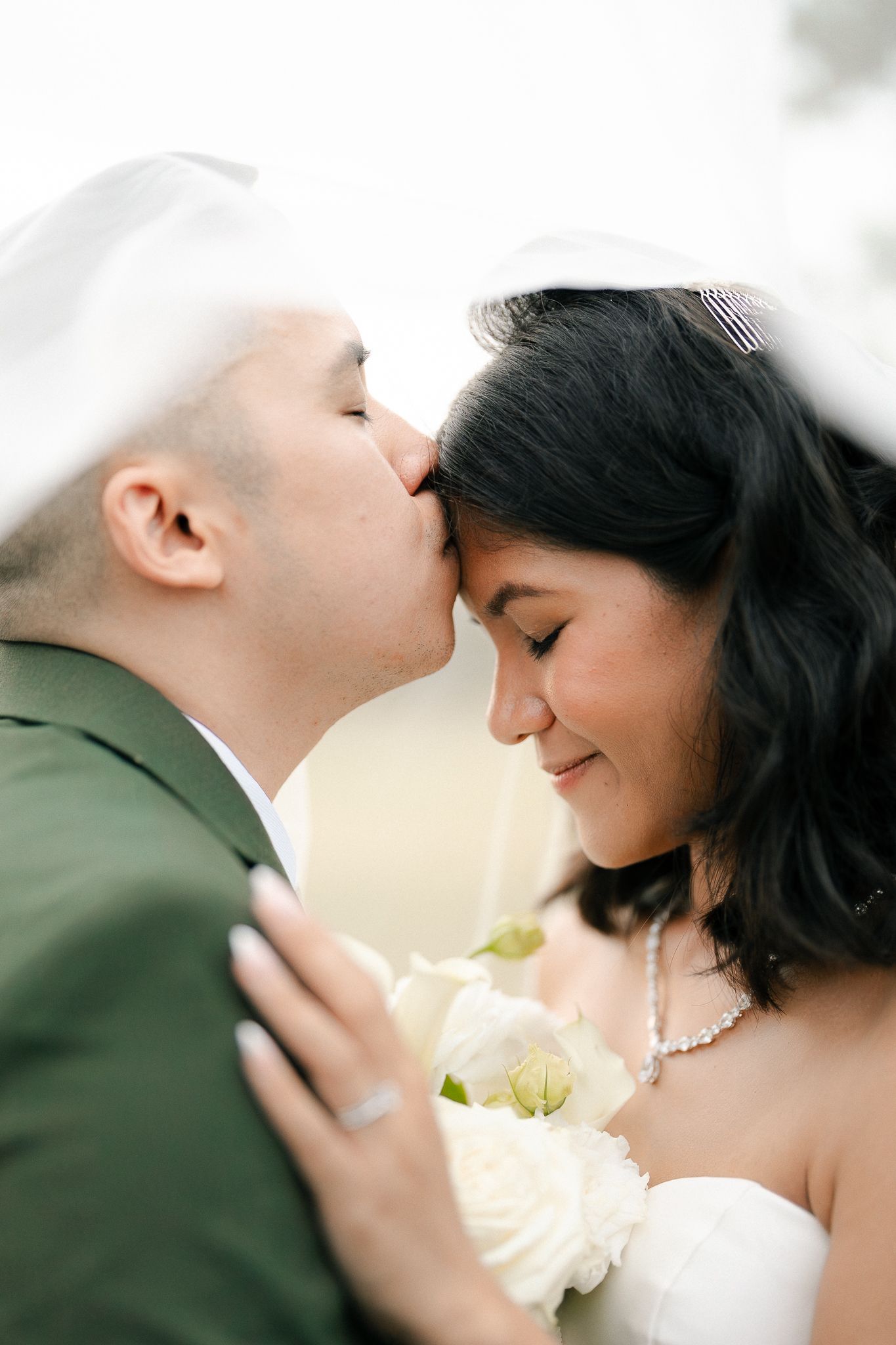 A romantic wedding photo series showing tender moments between a couple sharing intimate kisses.