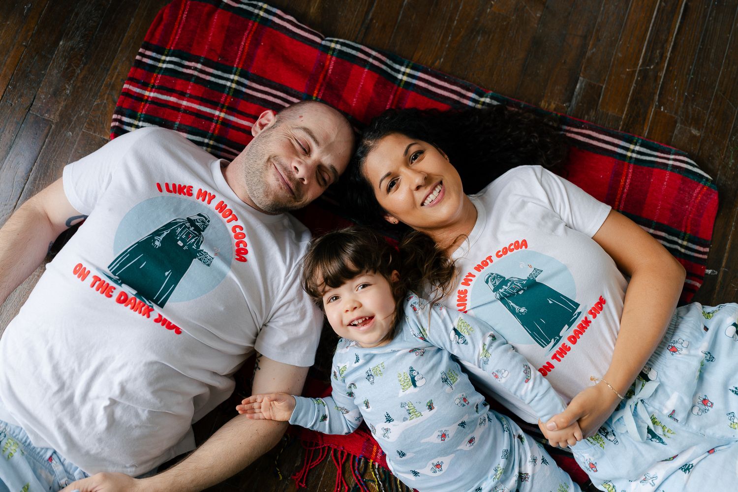 A series of photos showing people lying together on red plaid bedding in matching white t-shirts.