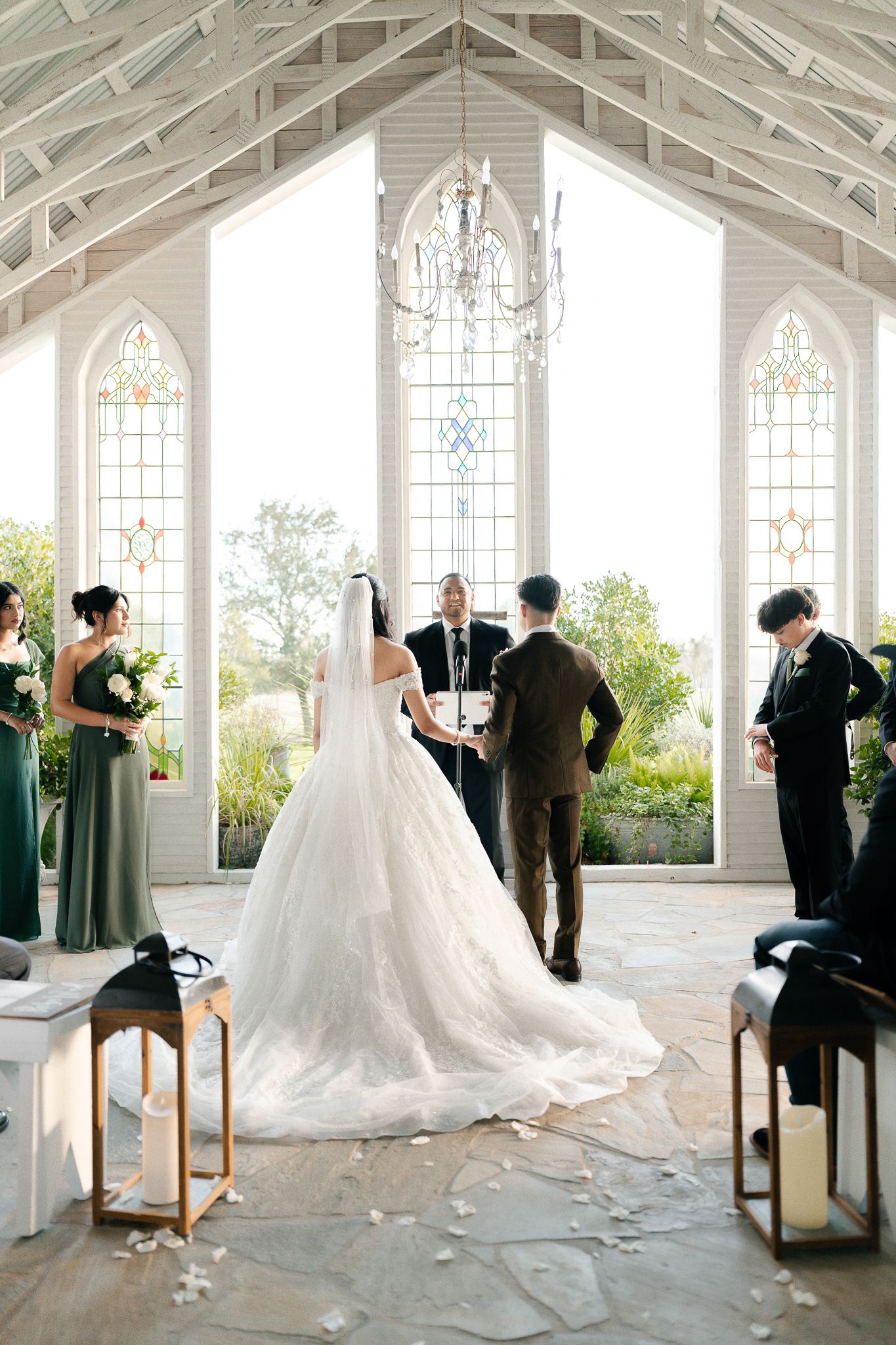 A sequence of wedding ceremony moments captured in a beautiful white chapel with stained glass windows.